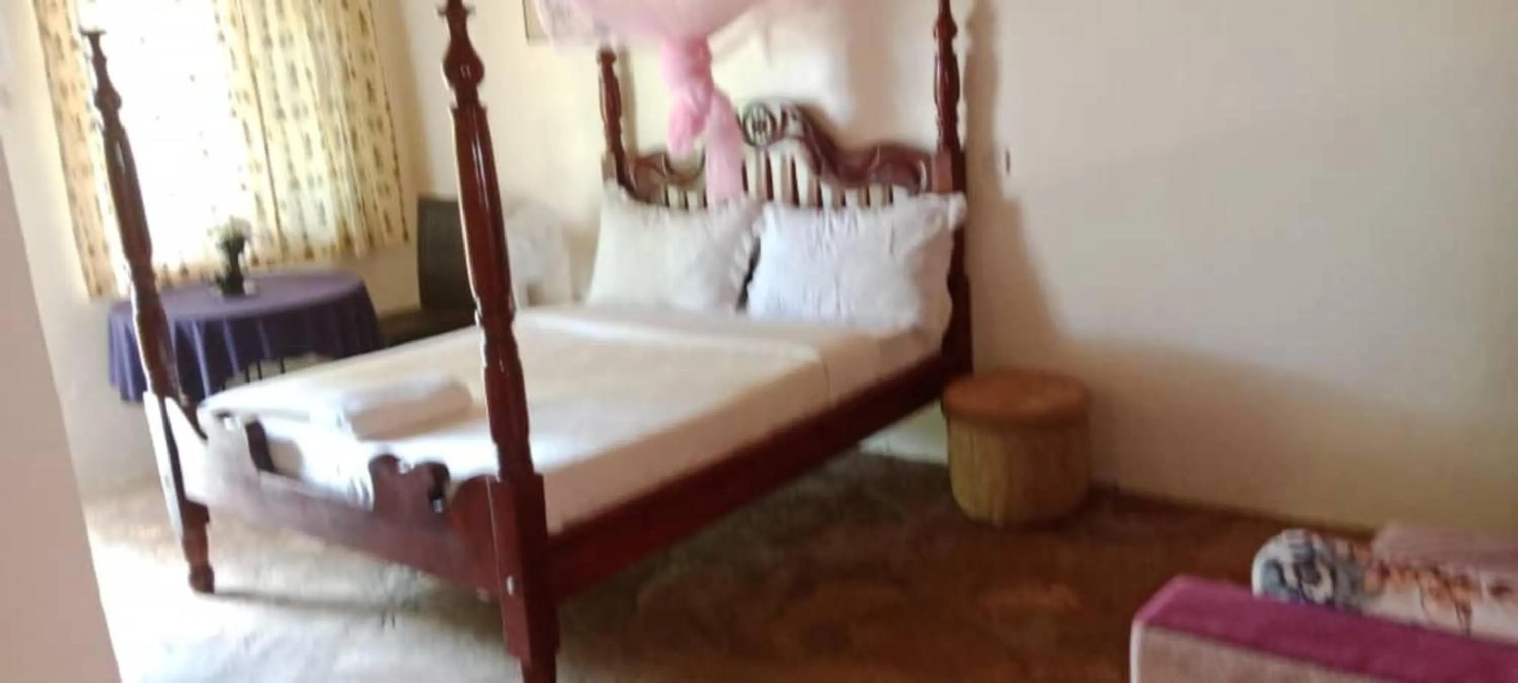 Bed in Gorilla African Guest House