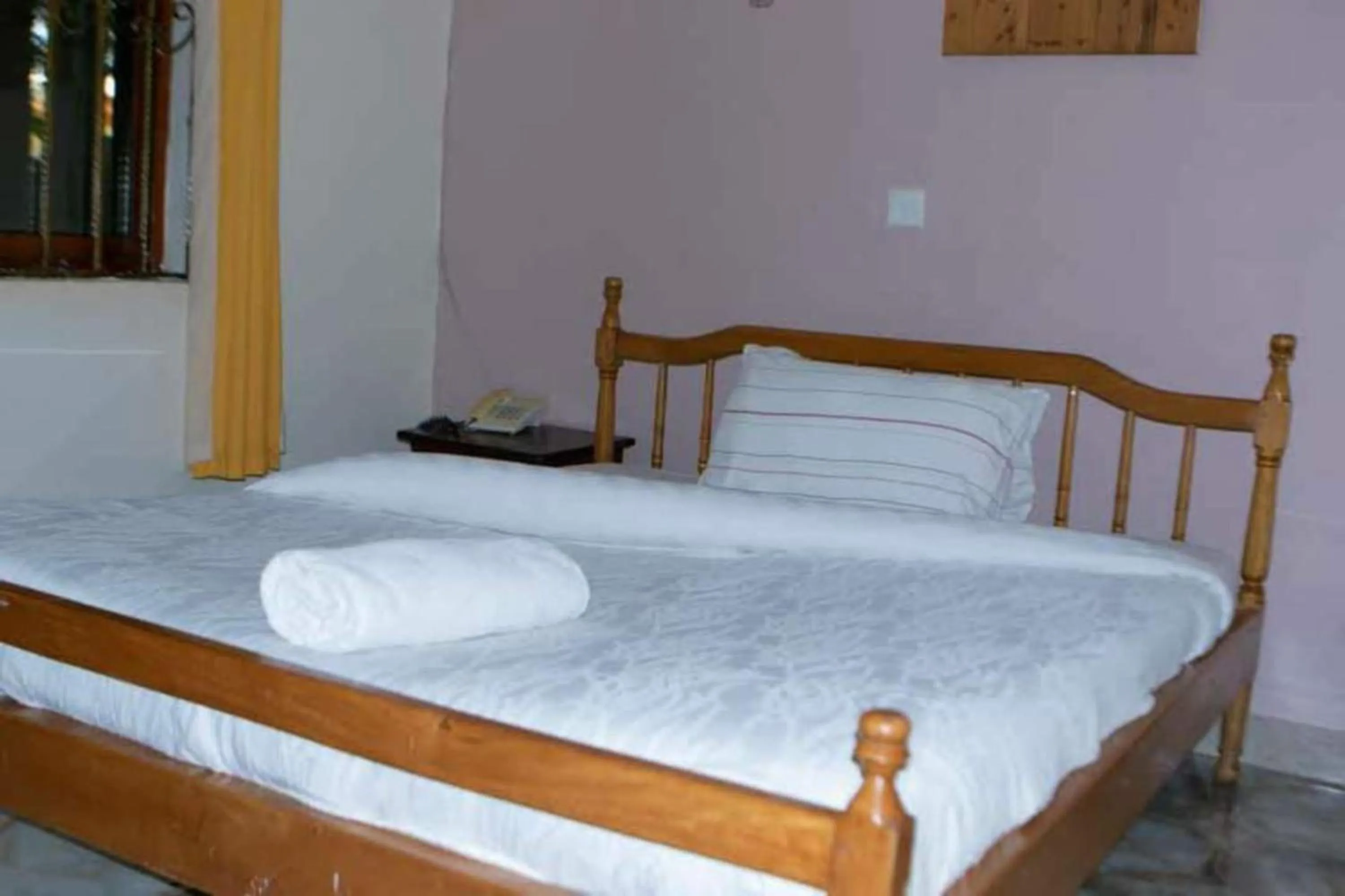 Bed in Gorilla African Guest House