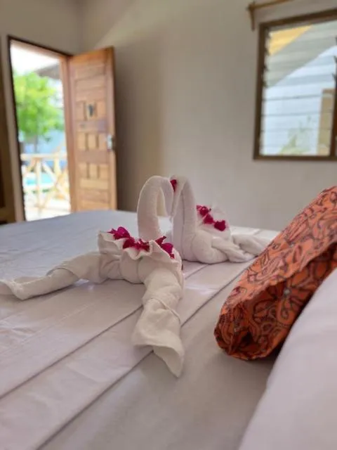 Bed in TATU INN Boutique Hotel WATAMU