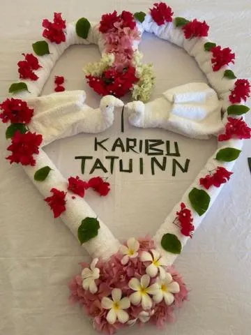 Text overlay in TATU INN Boutique Hotel WATAMU