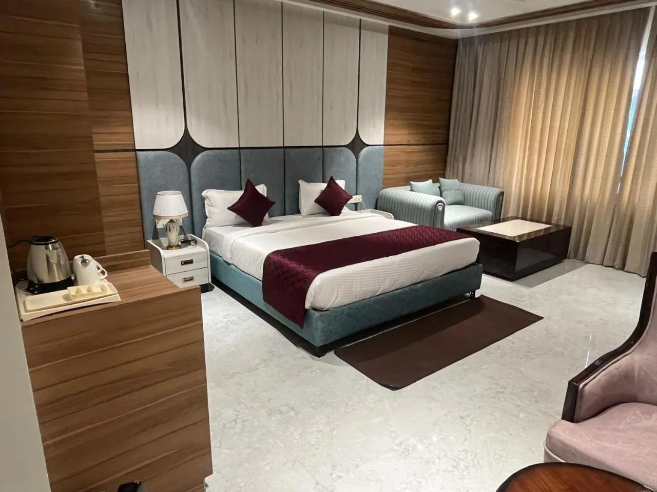 Bed in Nirvana Grand Hotel & Resort