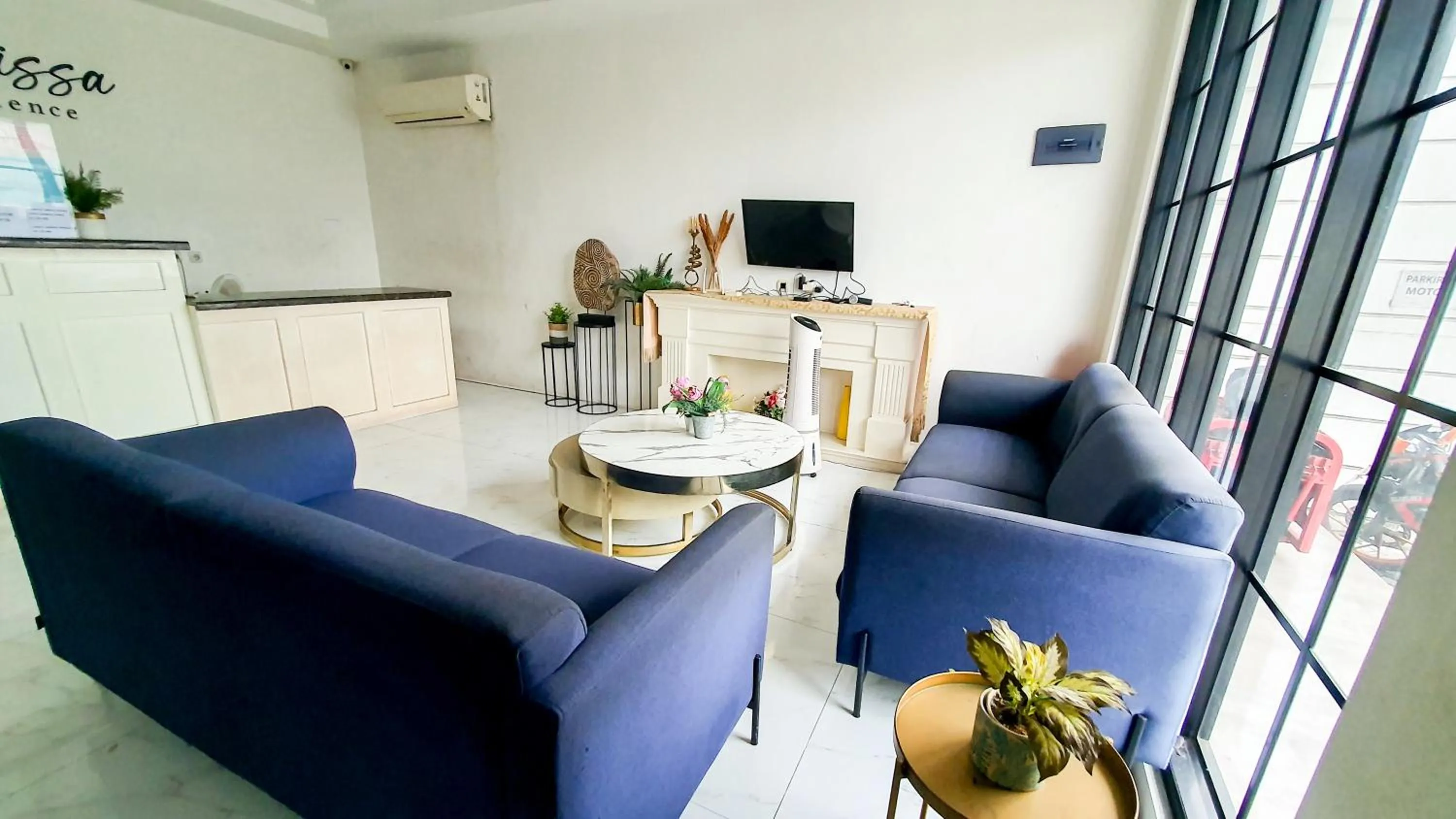 Seating area in La'Rissa Residence by ARBA