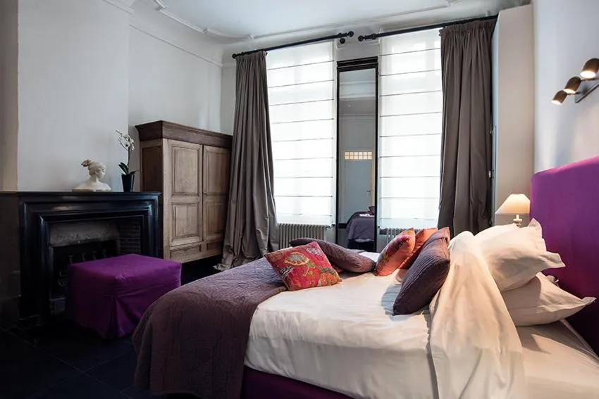 Bed in Ganda Rooms & Suites