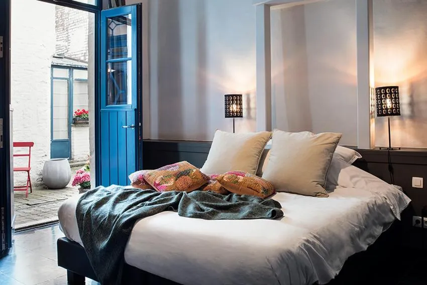 Bed in Ganda Rooms & Suites