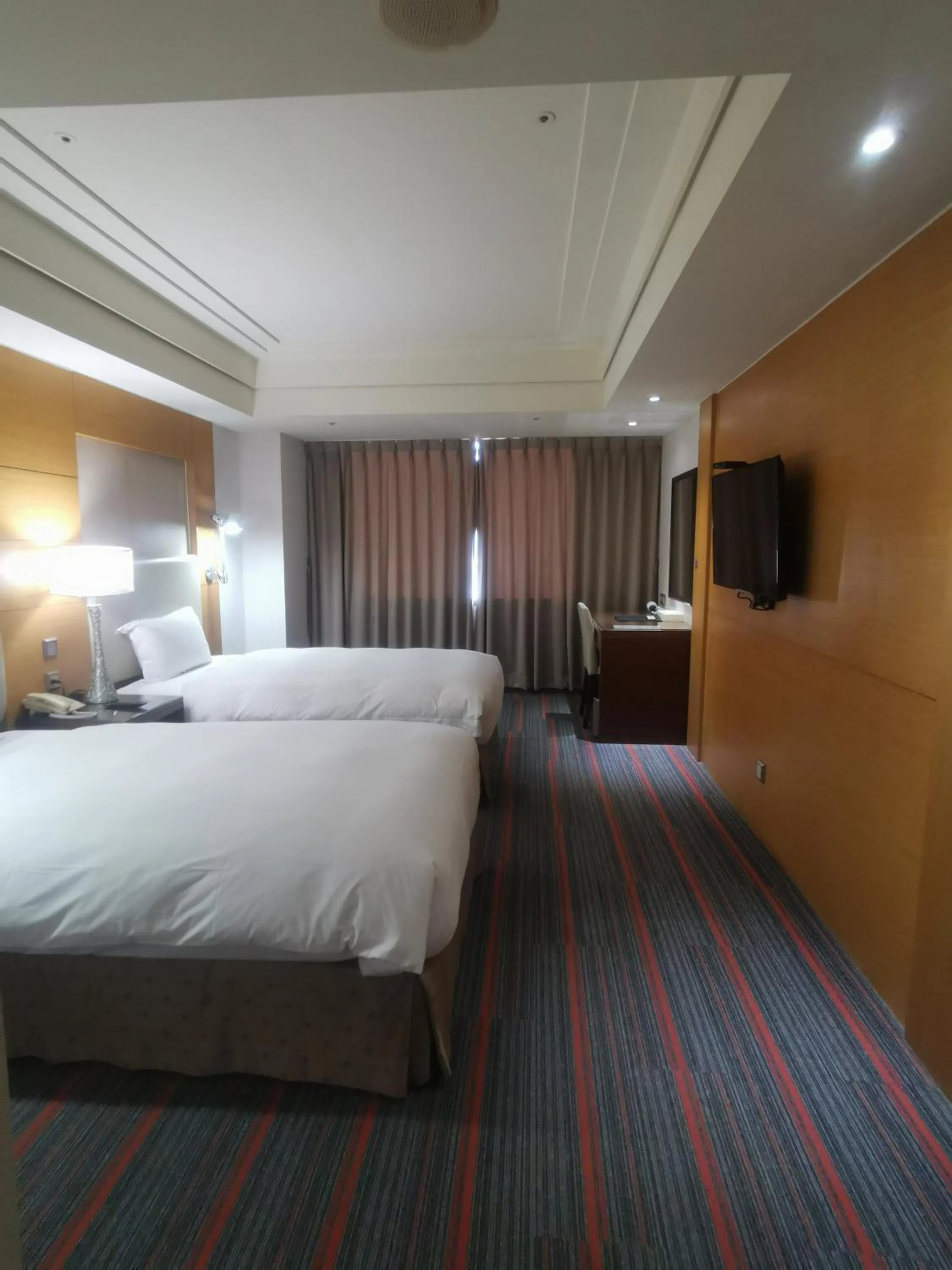 Bed in Ever Delightful Business Hotel