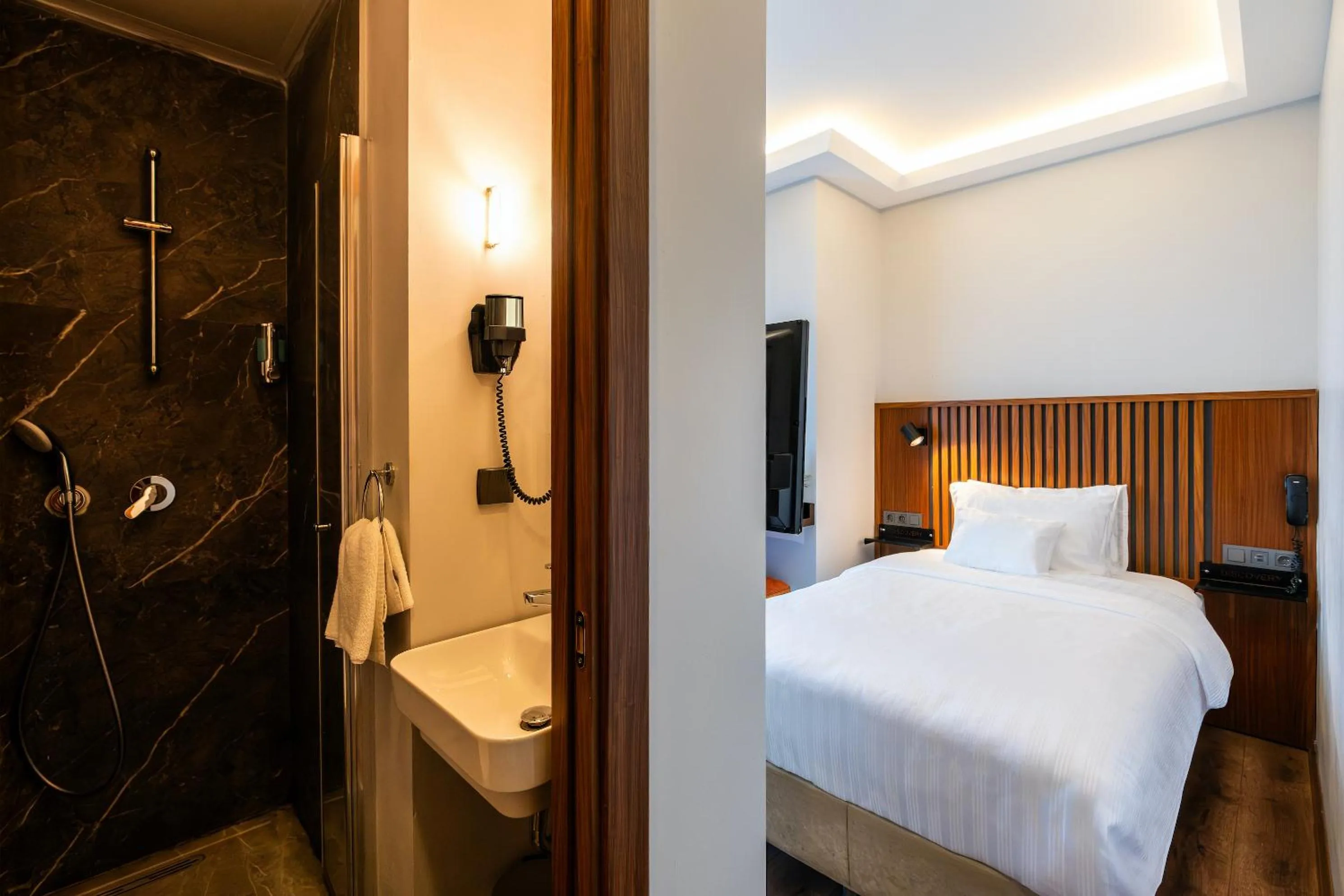 Bed in Discovery Hotel