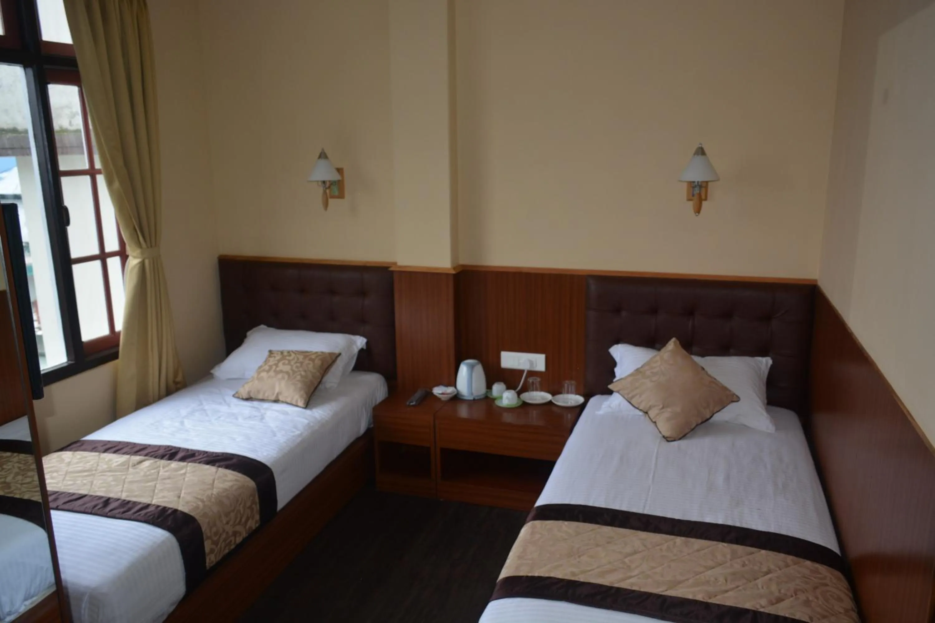 Bed in Juniper Residency Hotel
