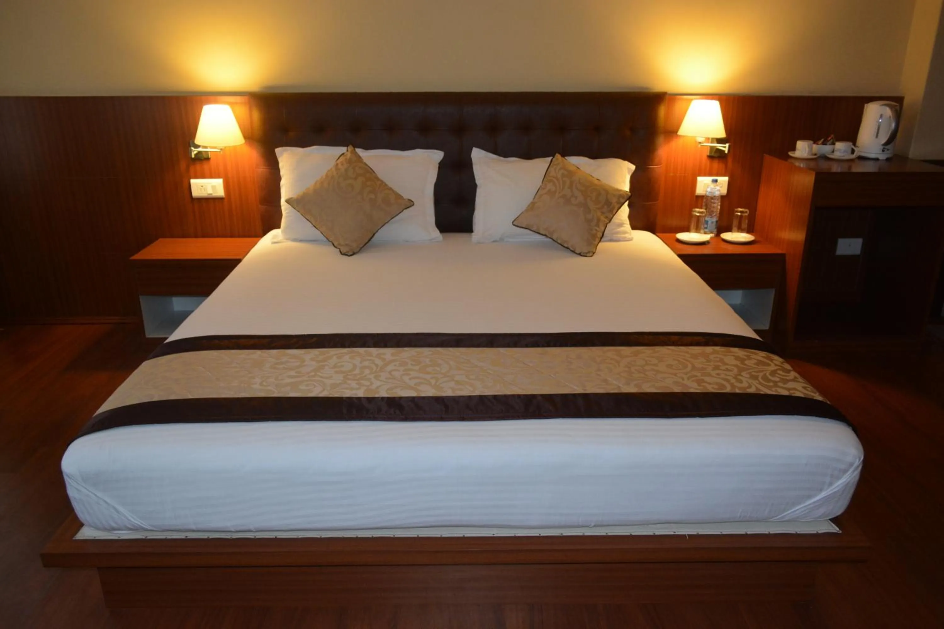 Bed in Juniper Residency Hotel