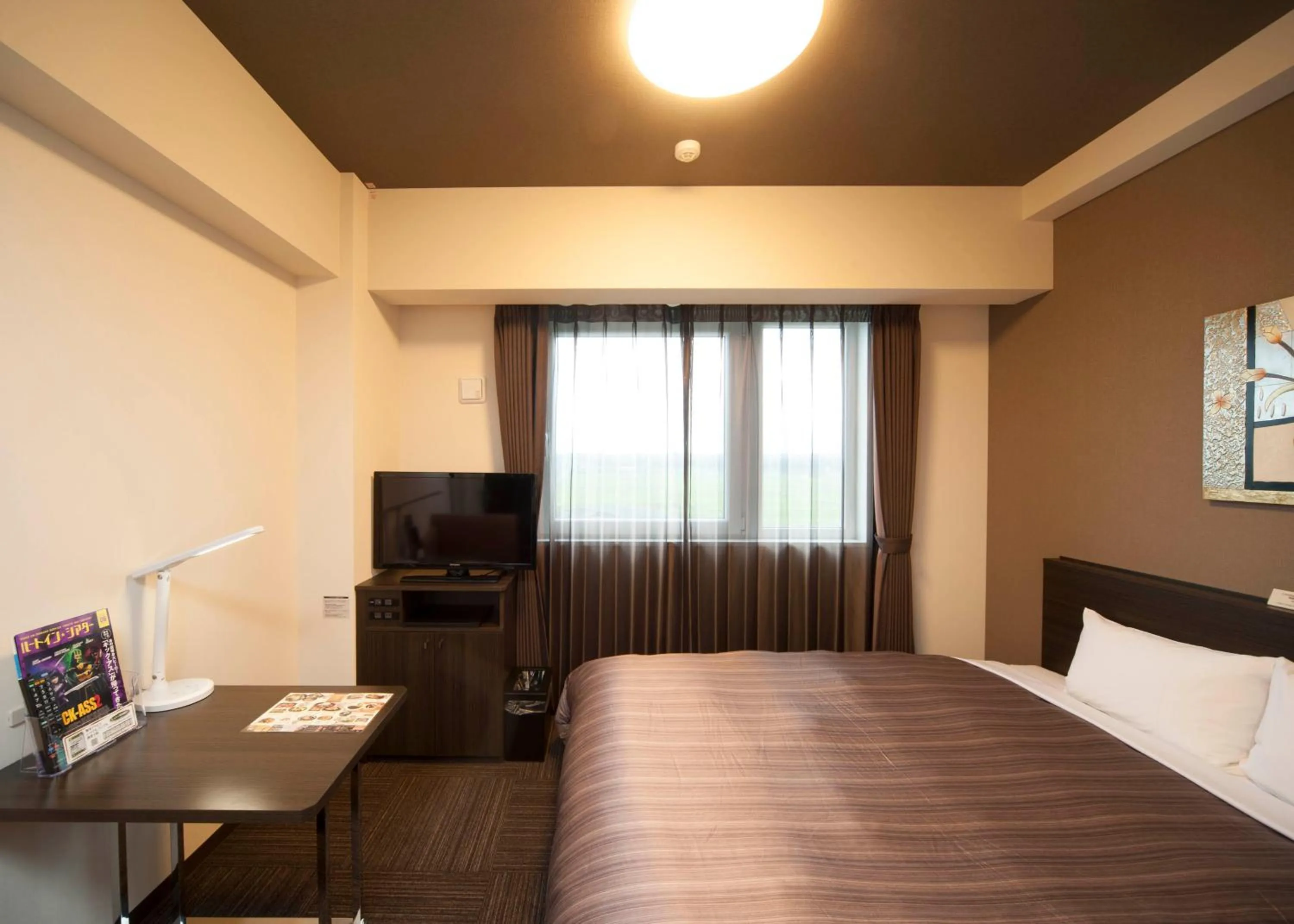 Photo of the whole room, Bed in Hotel Route Inn Hamamatsu Dealer Dori