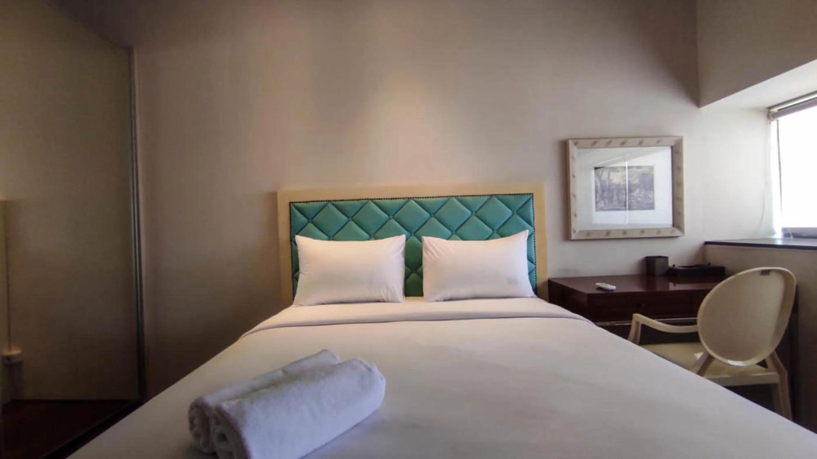 Bed in Apartment 3BR with River View in City Center at Sumatra36 Surabaya By Travelio