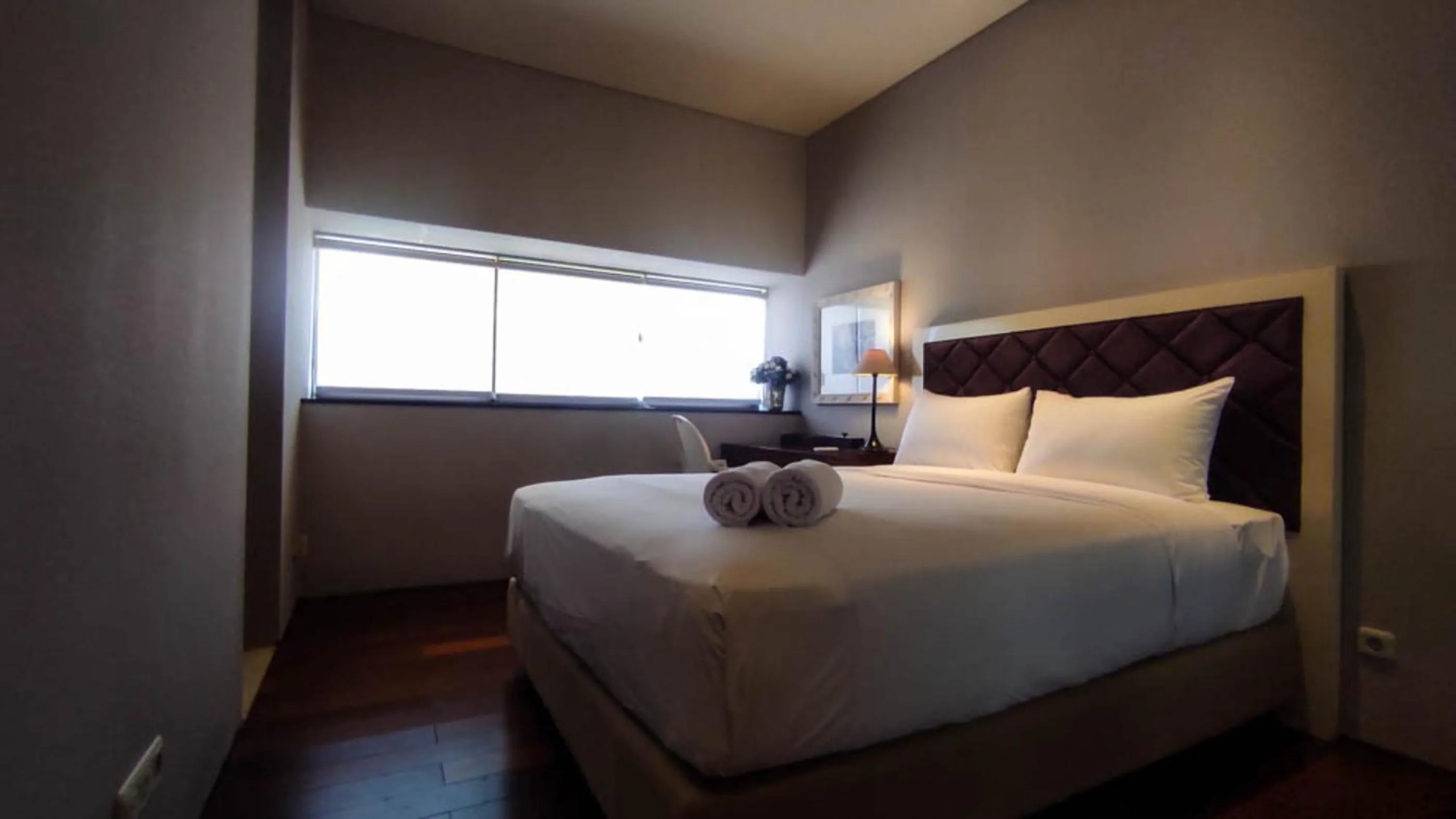 Bed in Apartment 3BR with River View in City Center at Sumatra36 Surabaya By Travelio