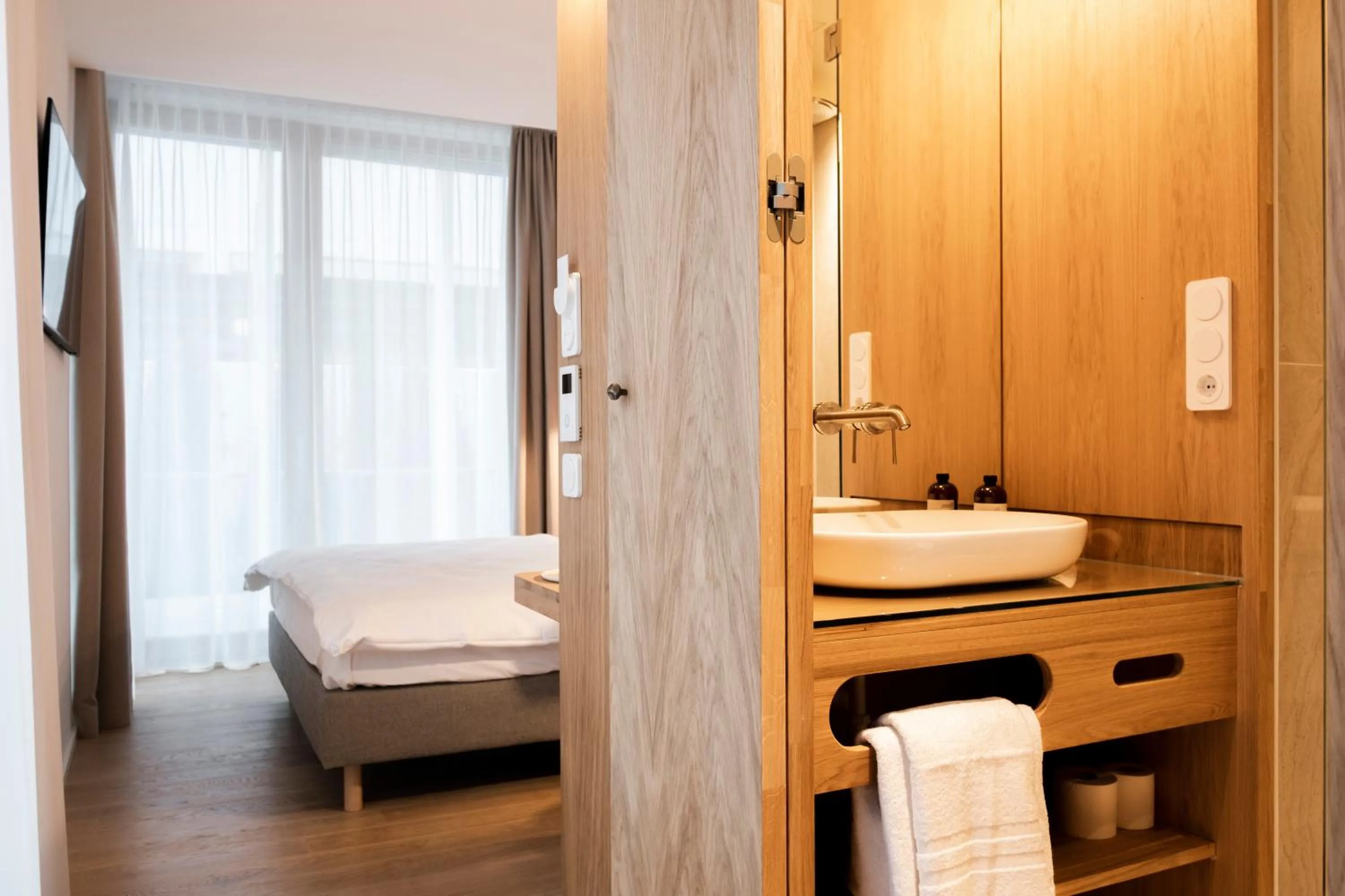 Bed in Das Kaya Hotel Stuttgart Airport Messe