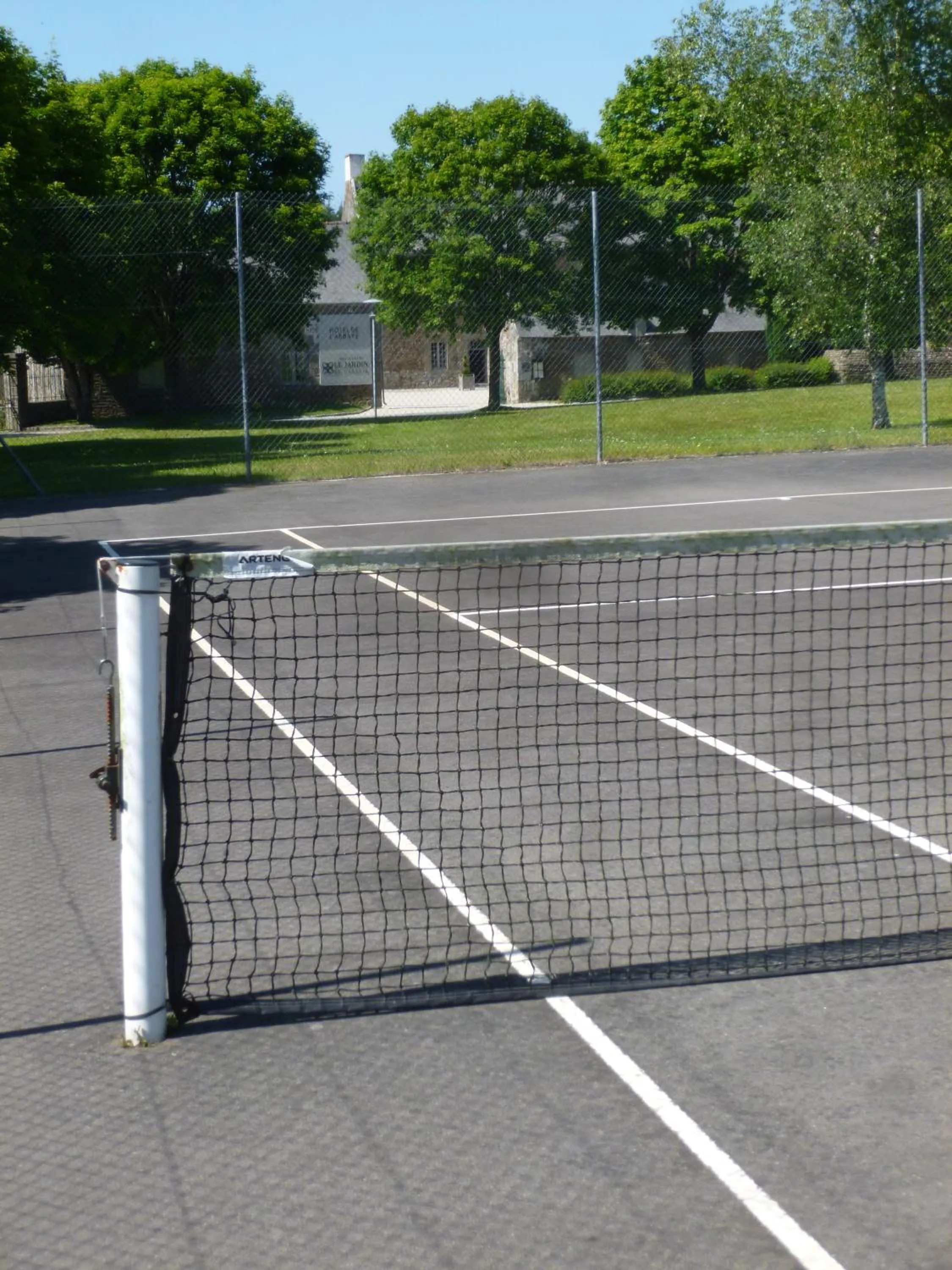 Tennis court in Hotel de L'Abbaye Le Tronchet - Handwritten Collection