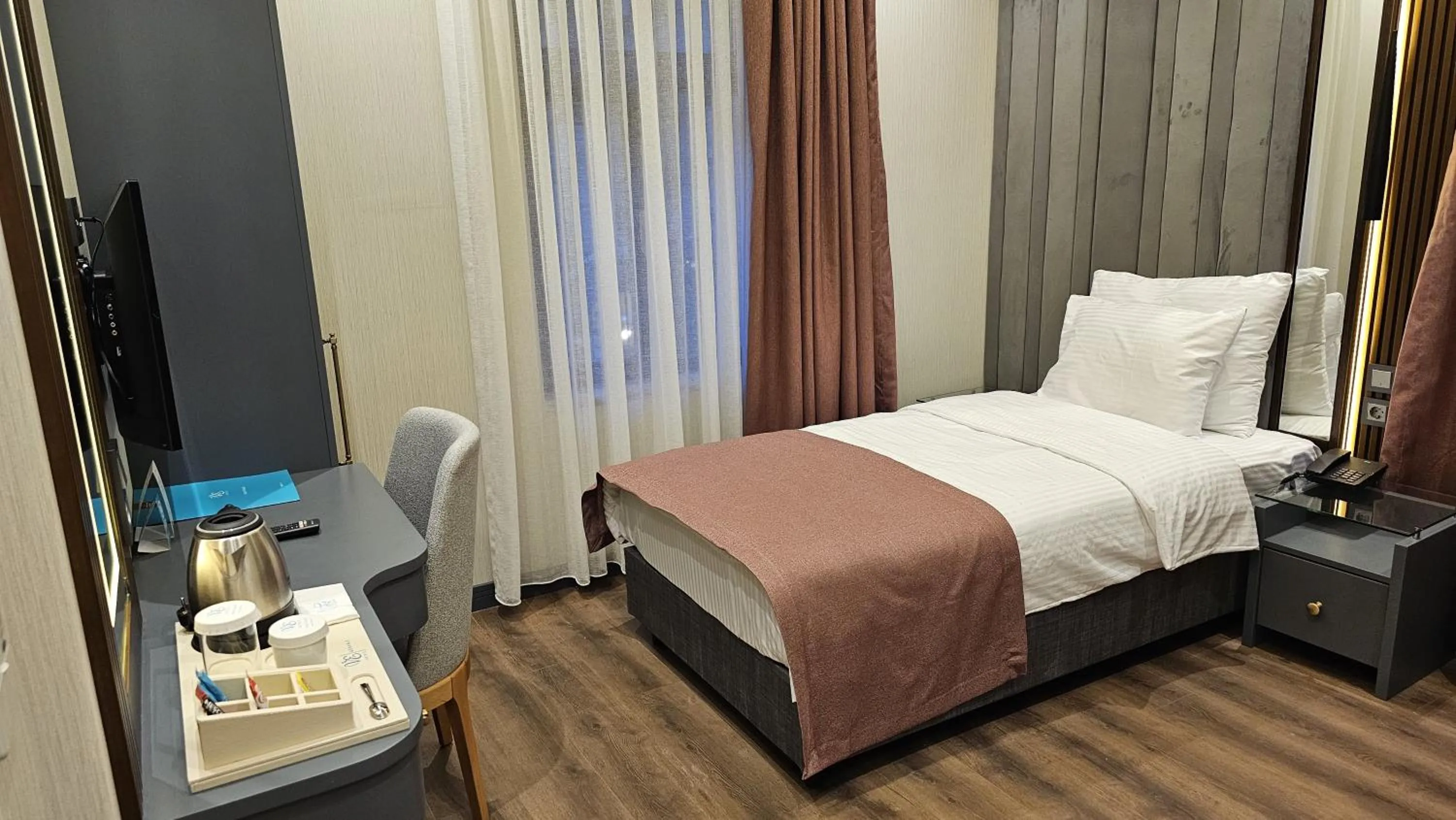 Bed in VE Hotels Adakale