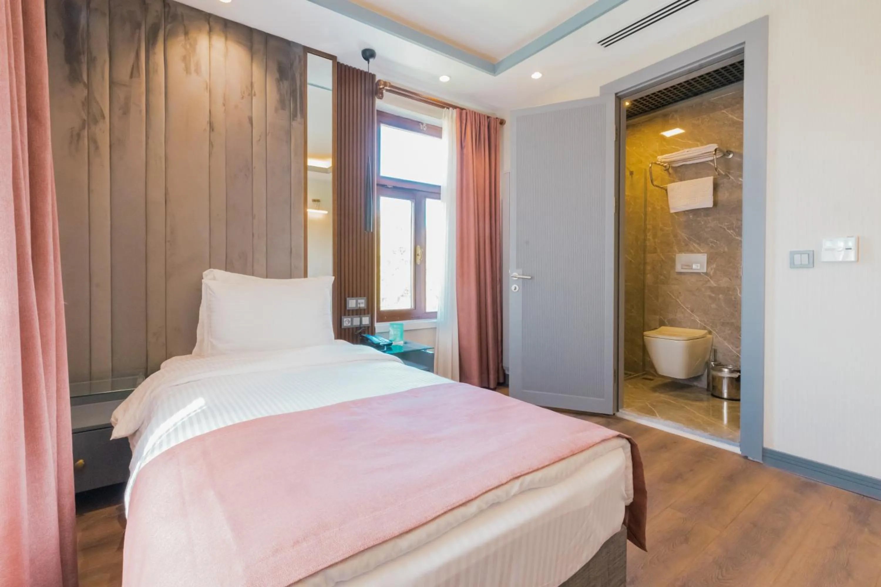 Bed in VE Hotels Adakale