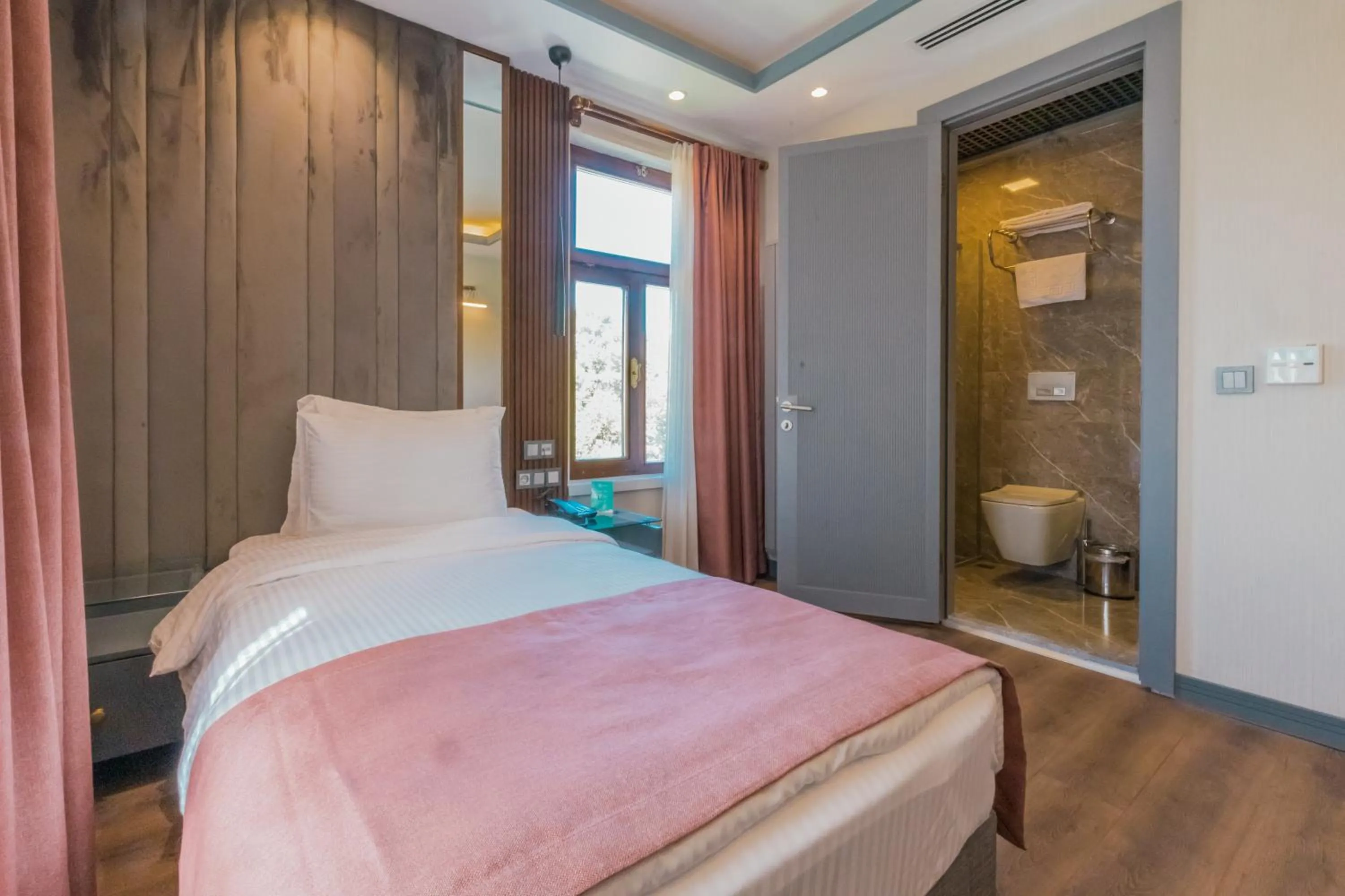 Bed in VE Hotels Adakale