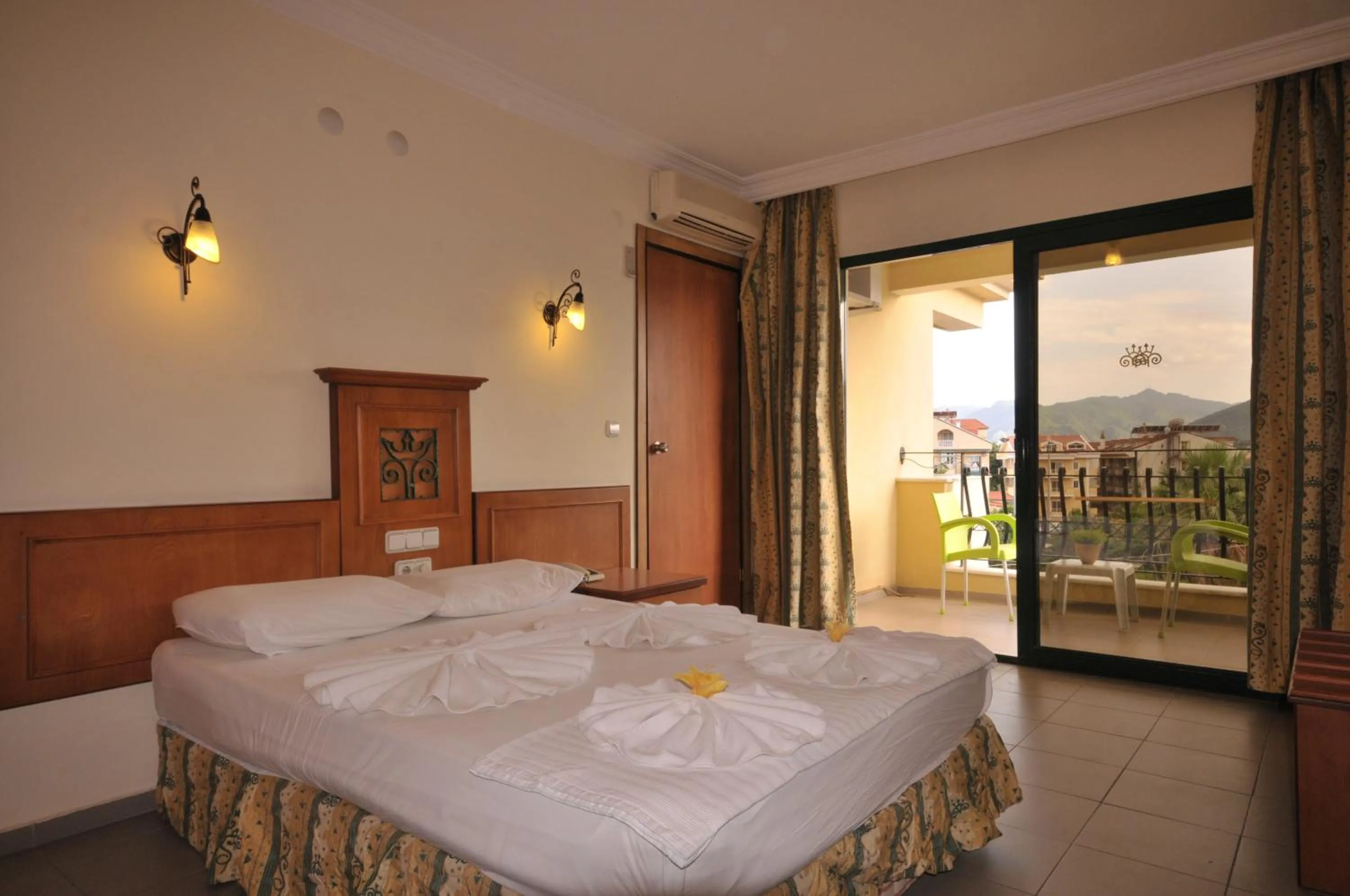 Bed in Aegean Princess Apartments And Studio