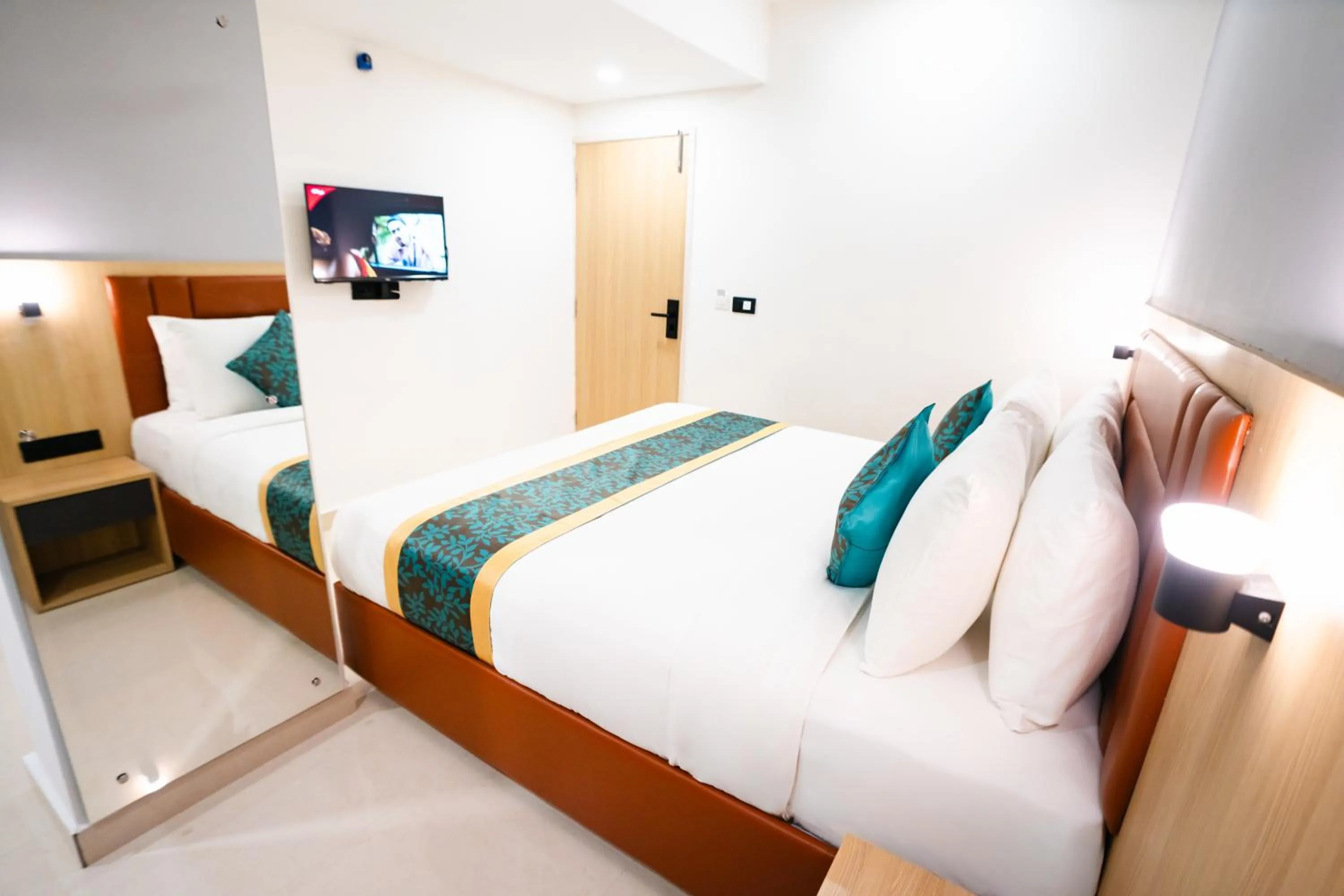 Photo of the whole room, Bed in Sunrise Business Hotel, S R Nagar - Ameerpet