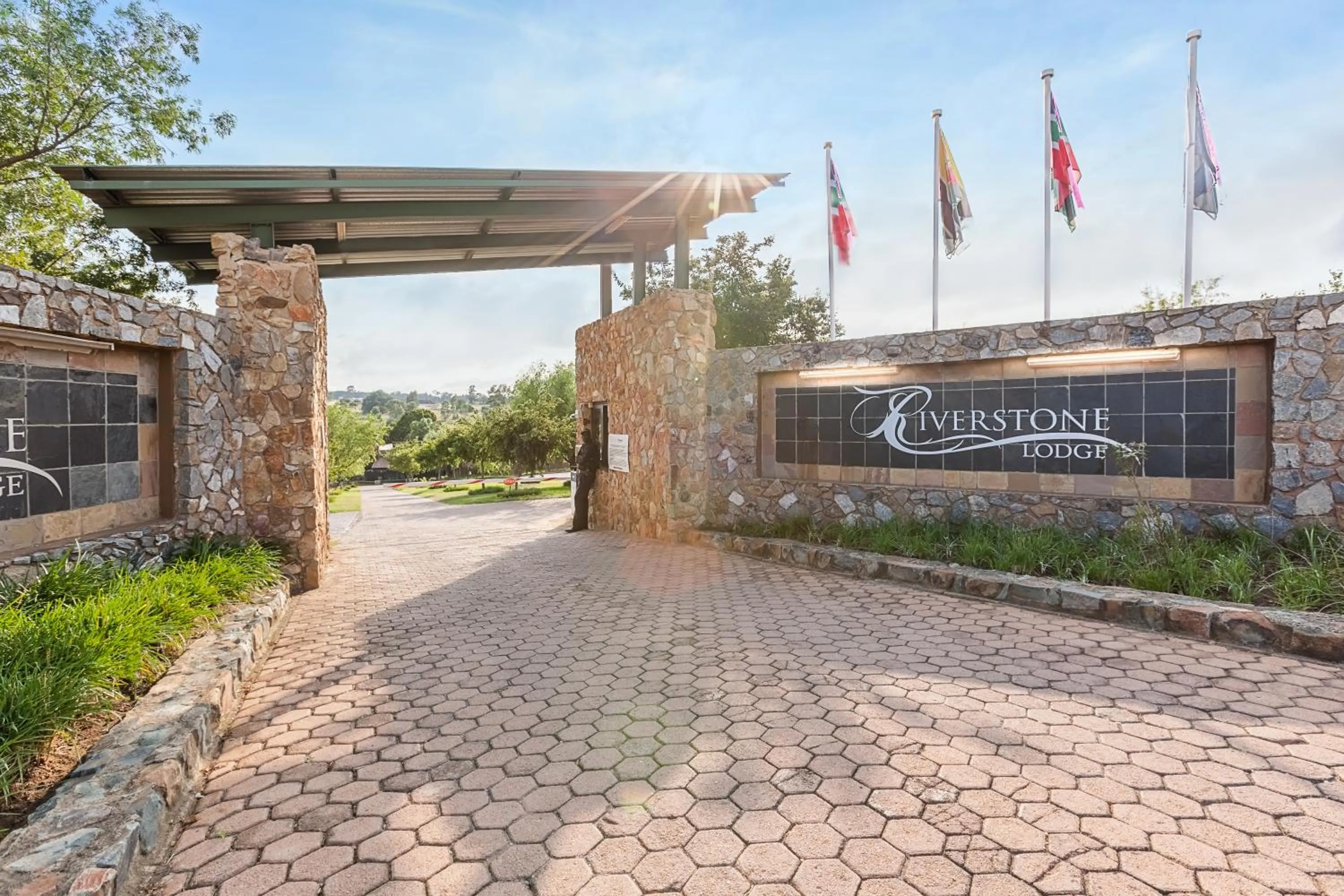 Property logo or sign in Riverstone Lodge