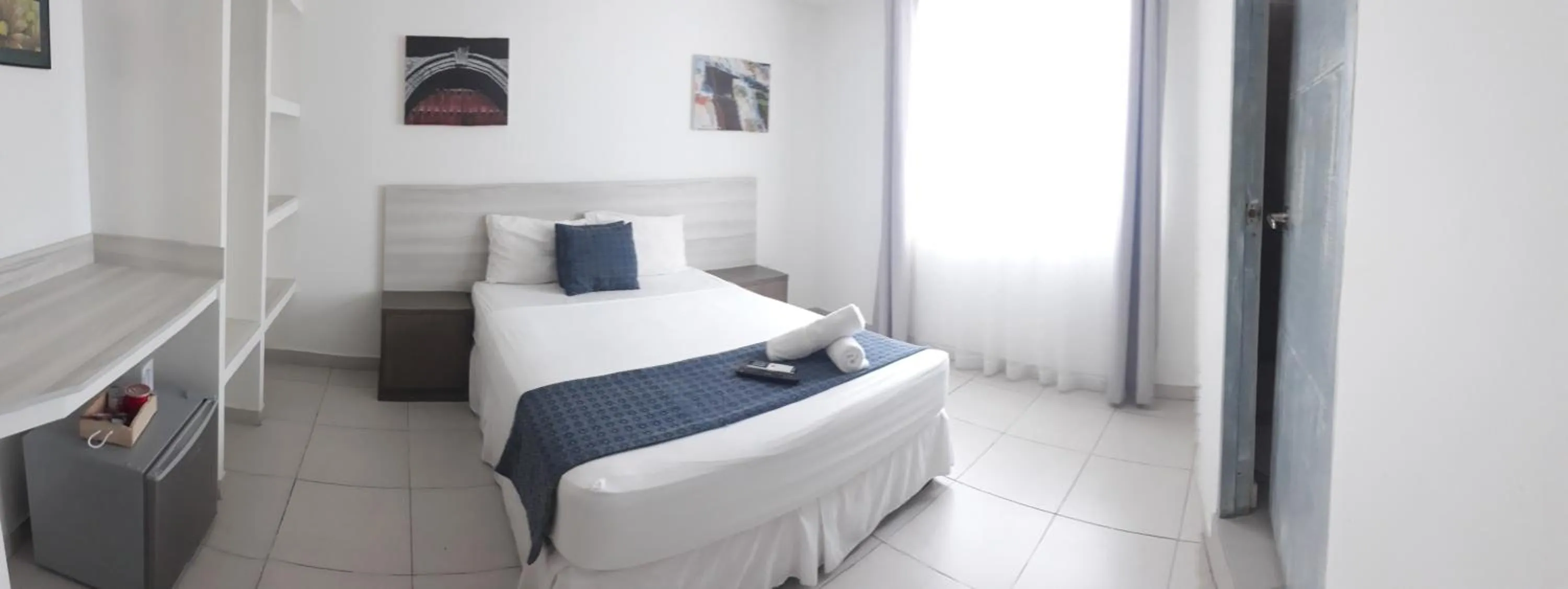 Photo of the whole room, Bed in Mintaka Hotel + Lounge