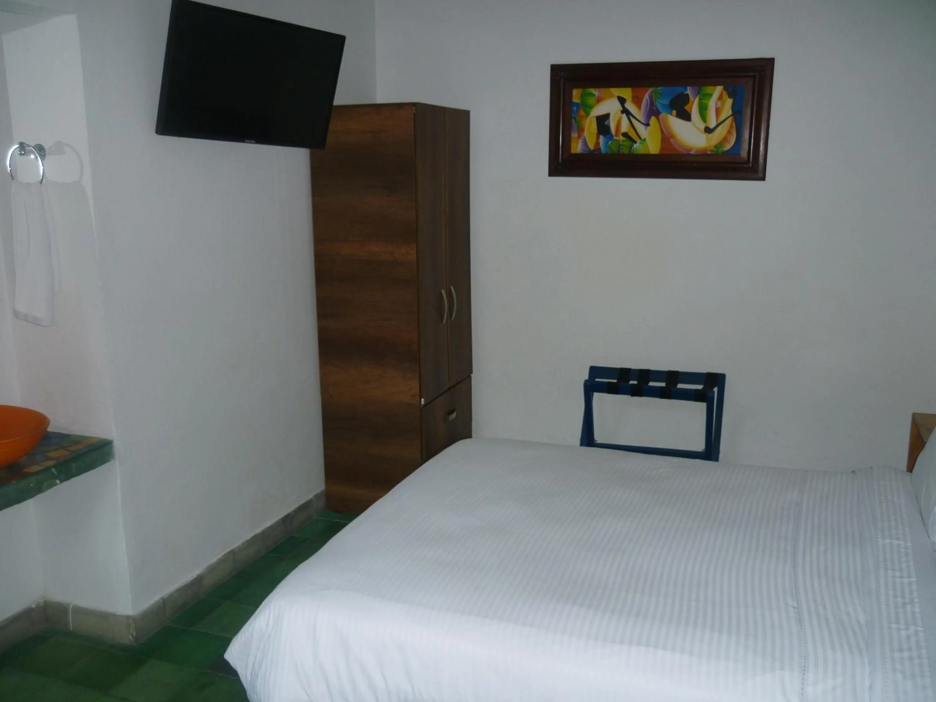 Communal lounge/ TV room, Bed in Zana Hotel Boutique