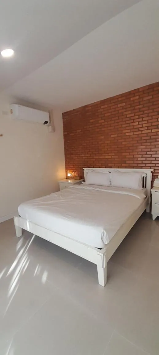 Bed in To The Moon Guesthouse