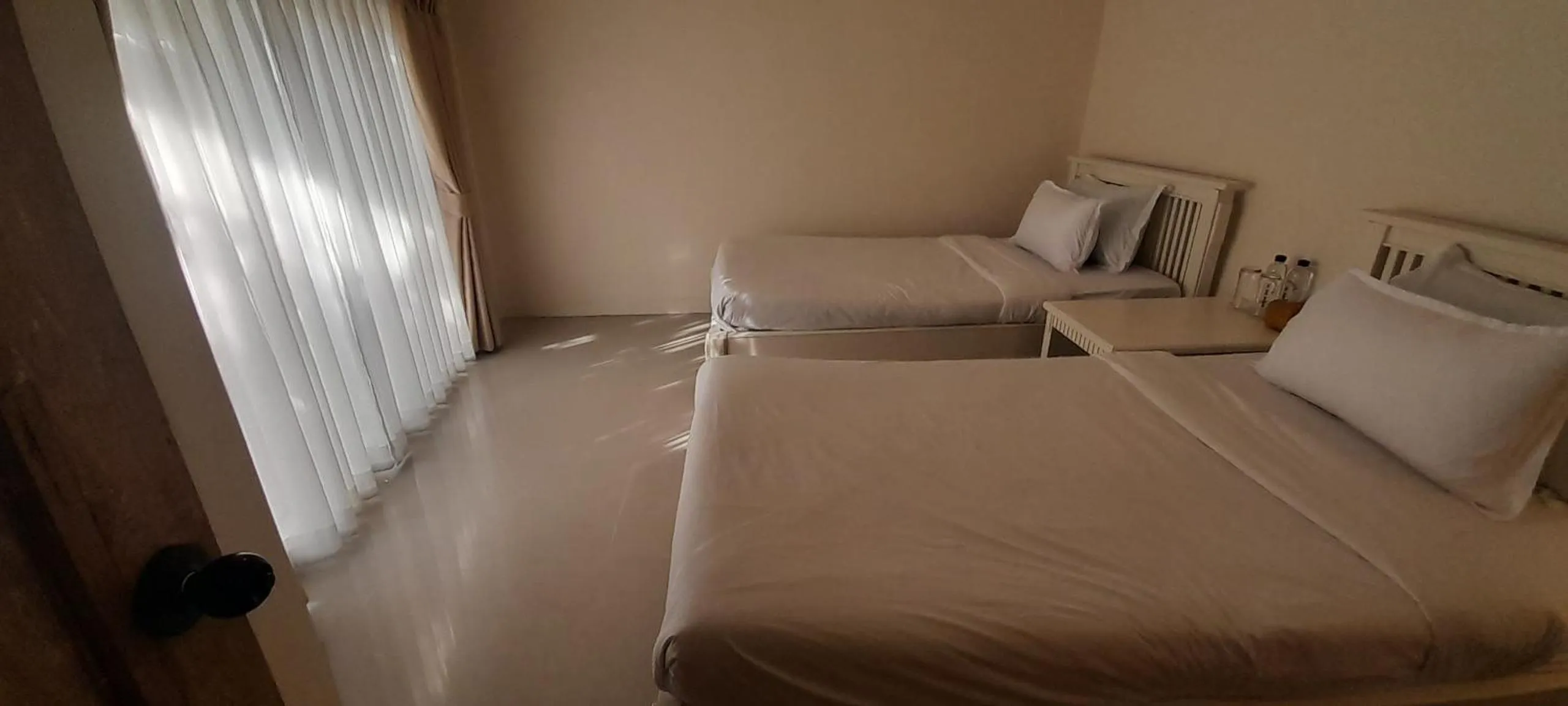 Bed in To The Moon Guesthouse