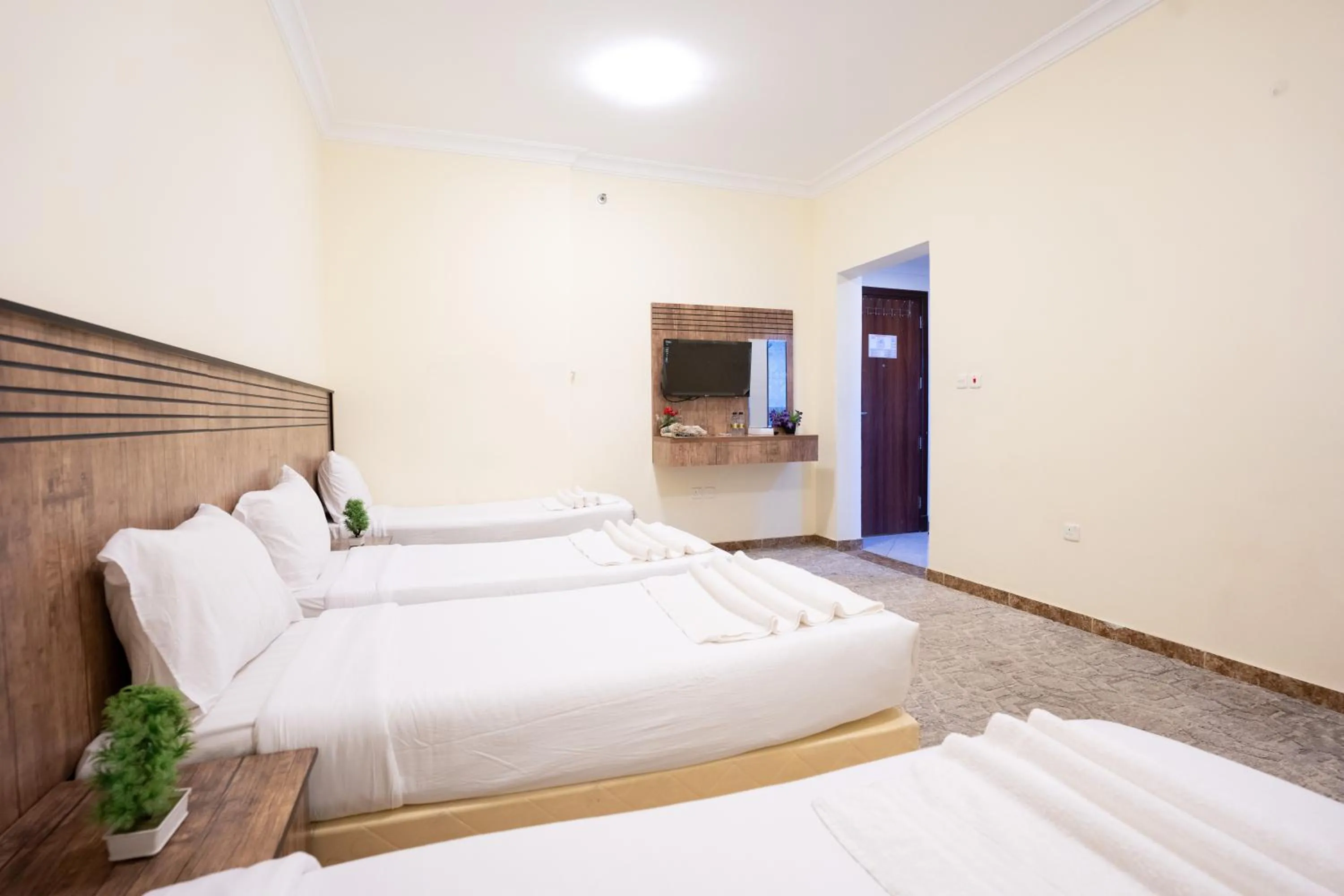 Quadruple Room with Private Bathroom in Saif Plus 3 Hotel by Orvana