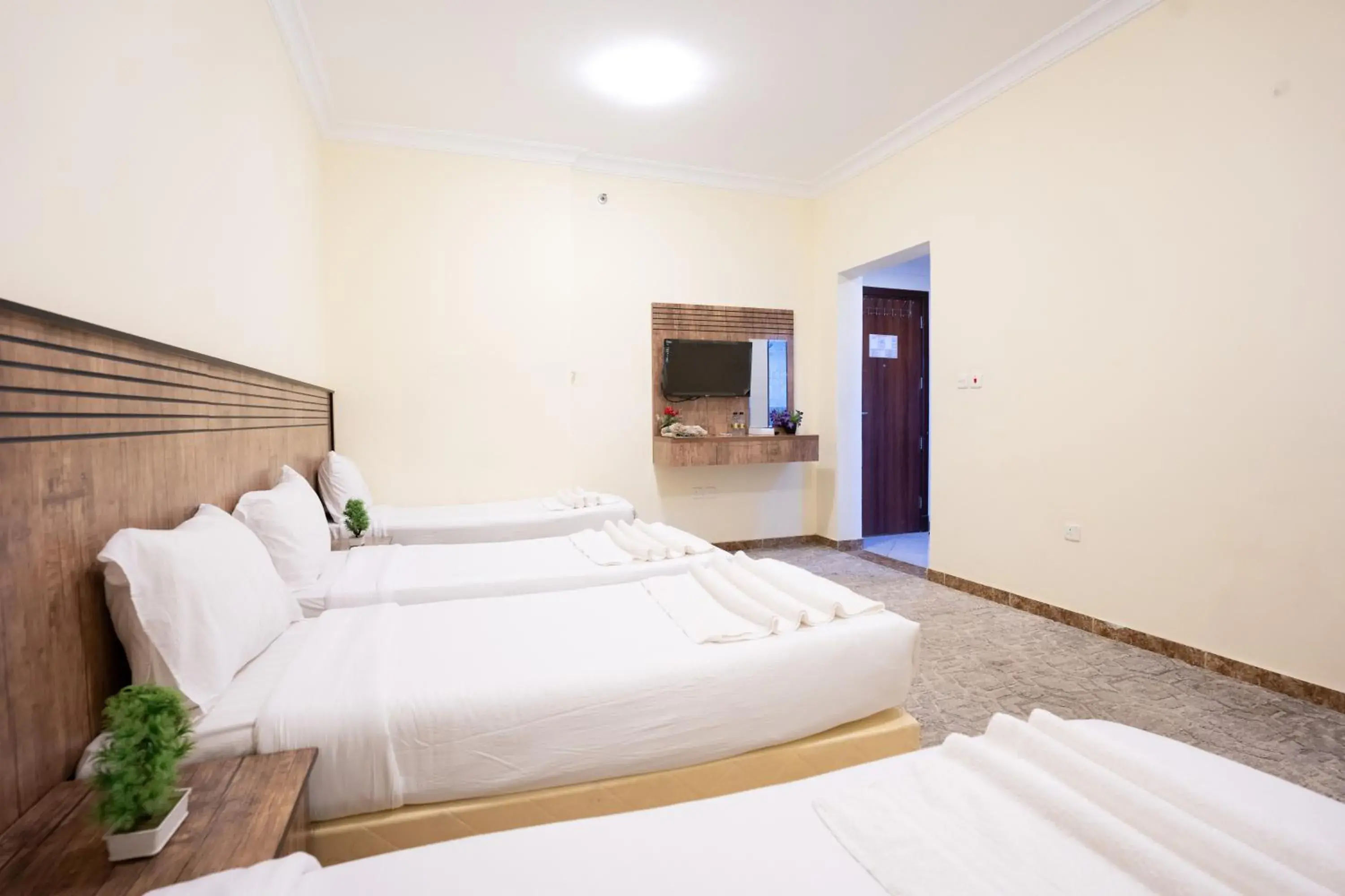 Quadruple Room with Private Bathroom in Saif Plus 3 Hotel by Orvana Quadruple Room with Private Bathroom in Saif Plus 3 Hotel by Orvana