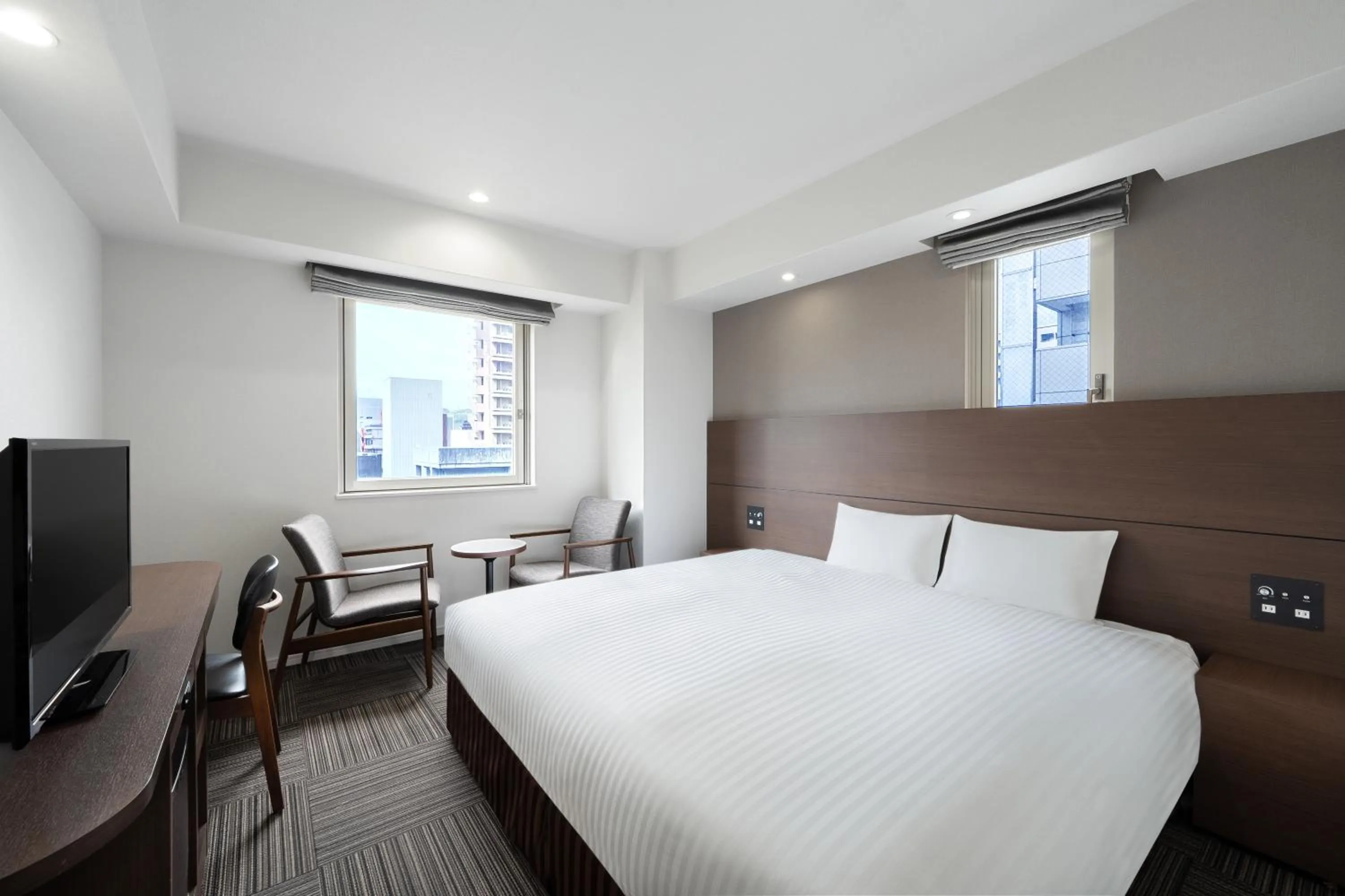 Bed in Hotel Oriental Express Kagoshima Tenmonkan