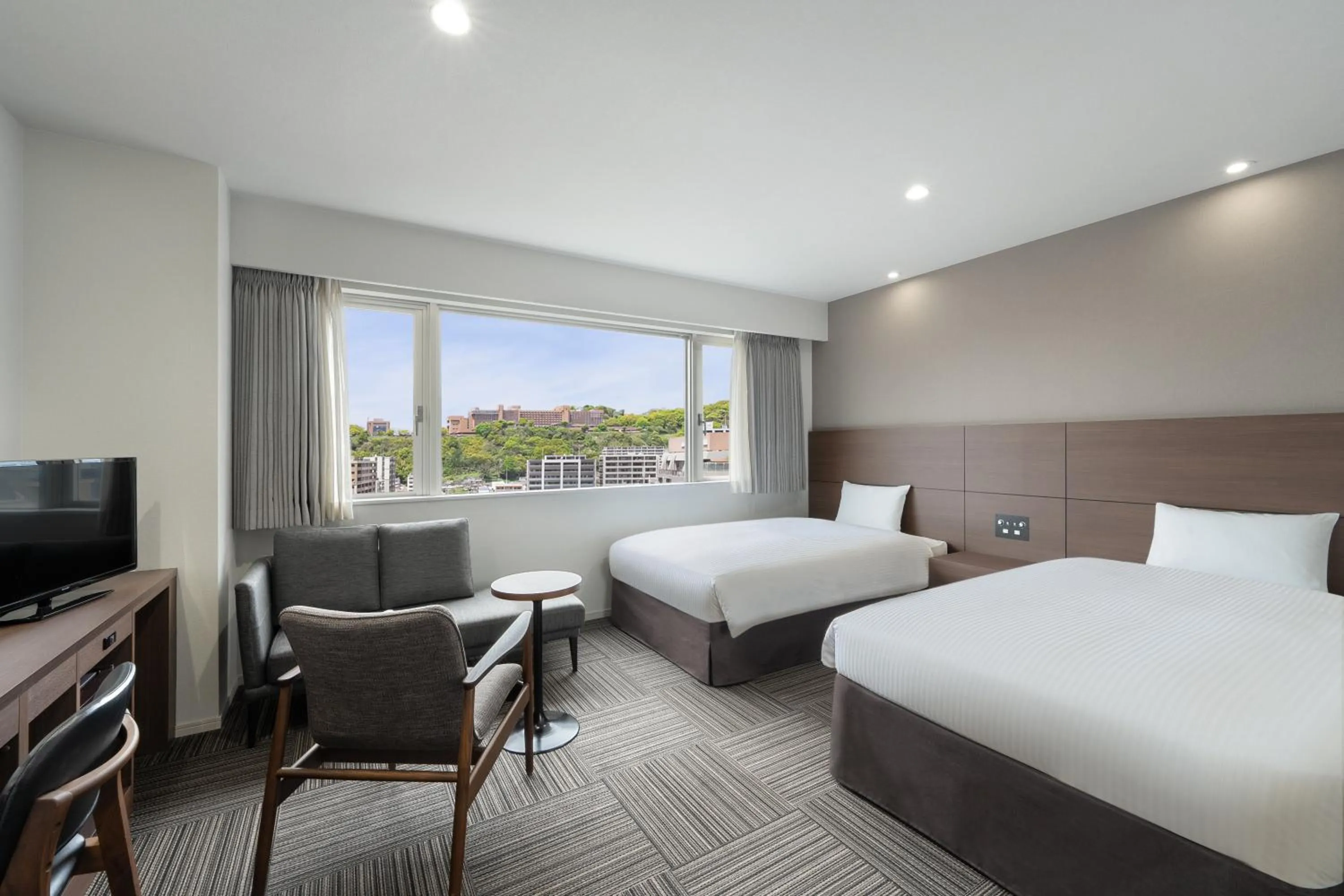 Bed in Hotel Oriental Express Kagoshima Tenmonkan