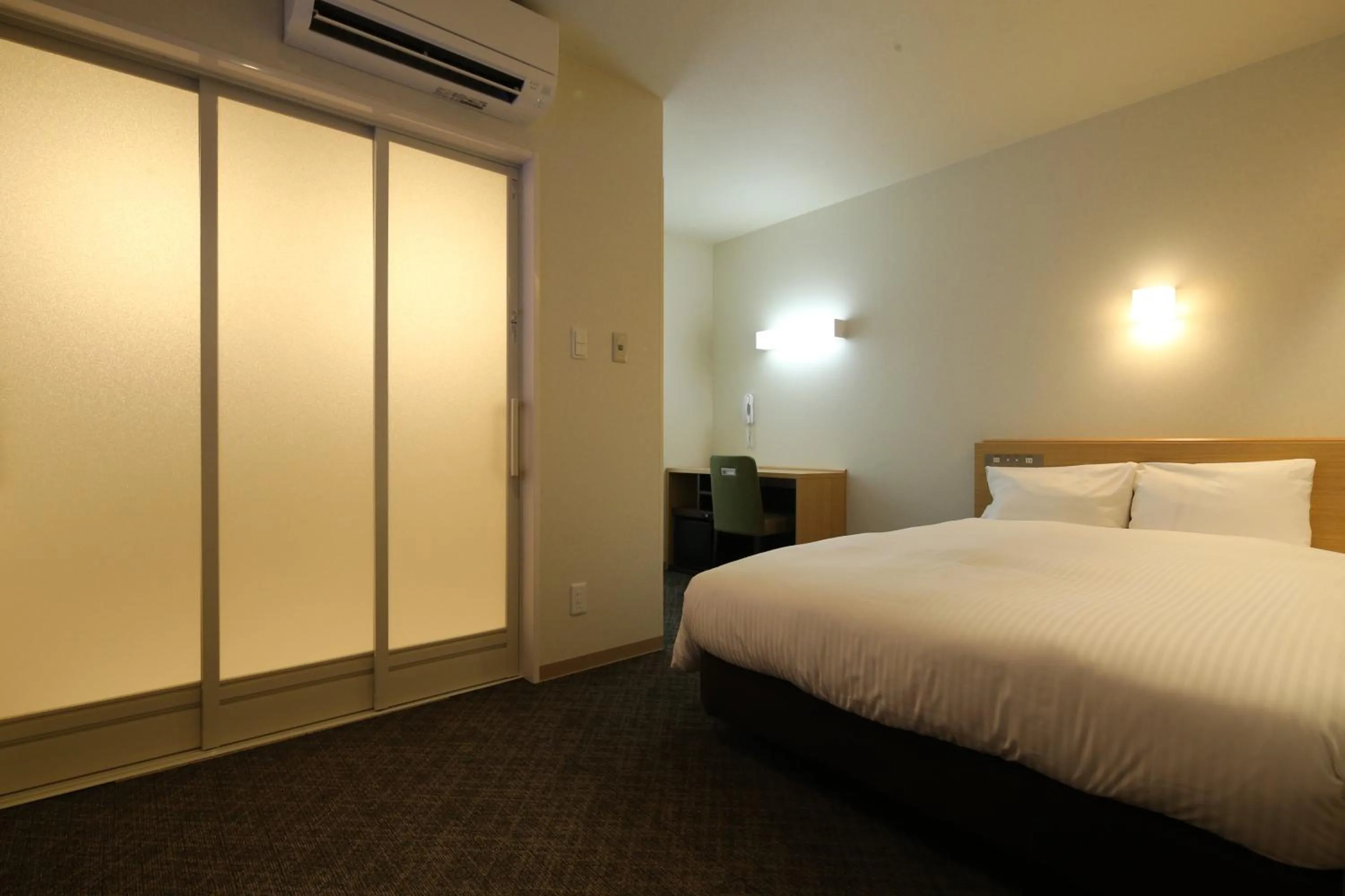 Bed in AB Hotel Sakaihigashi