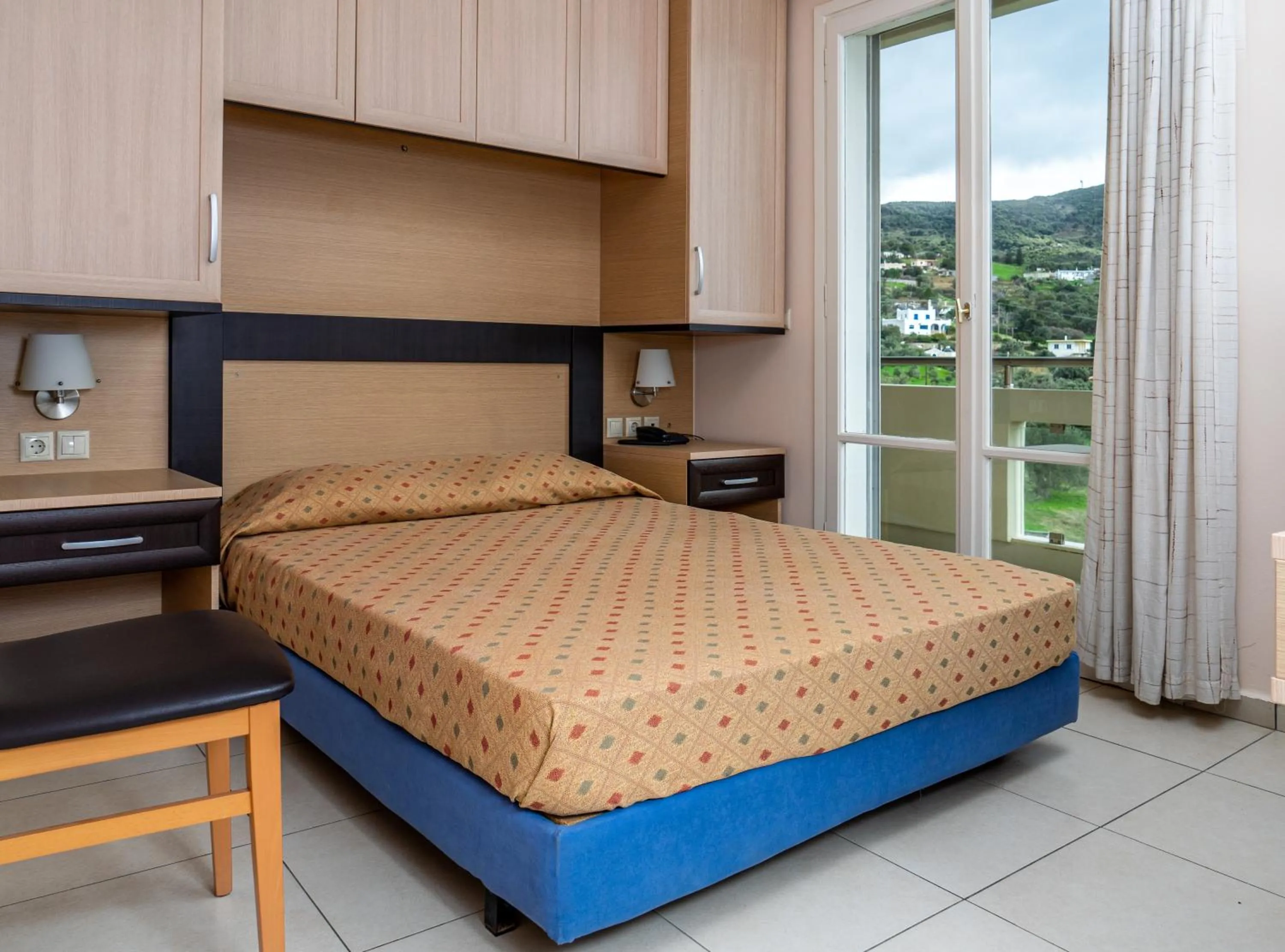 Bed in Marmari Bay Hotel