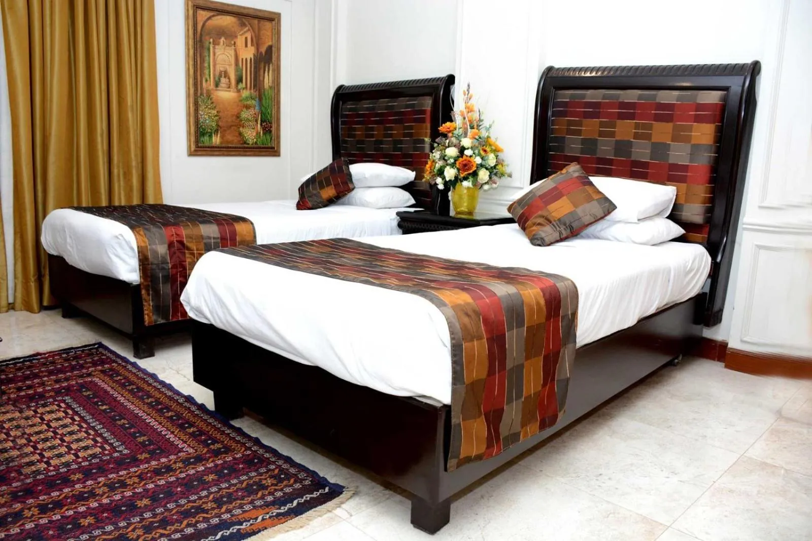 Bed in Regency Inn Hotel