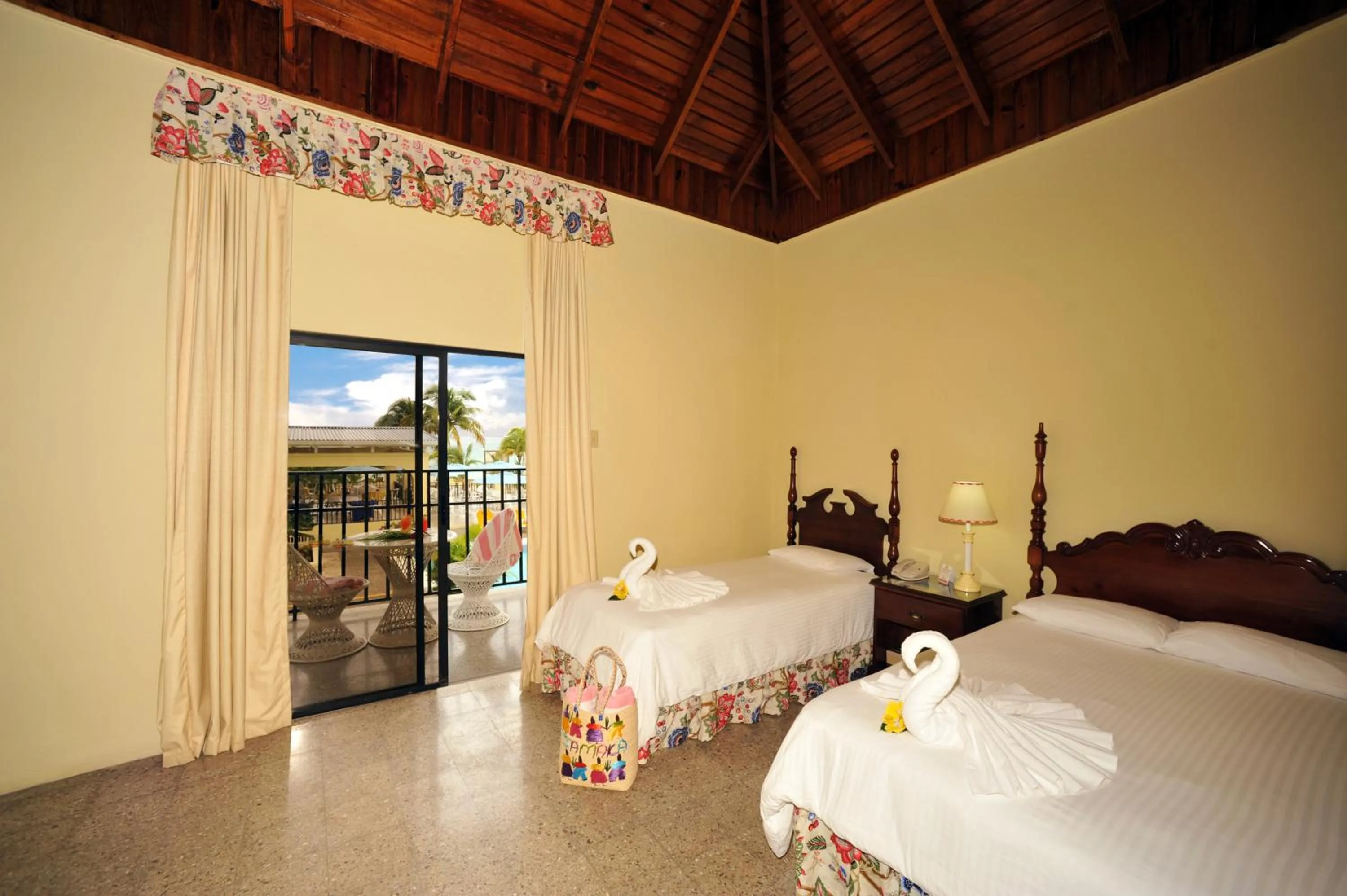 Shower, Bed in Rooms On The Beach Negril