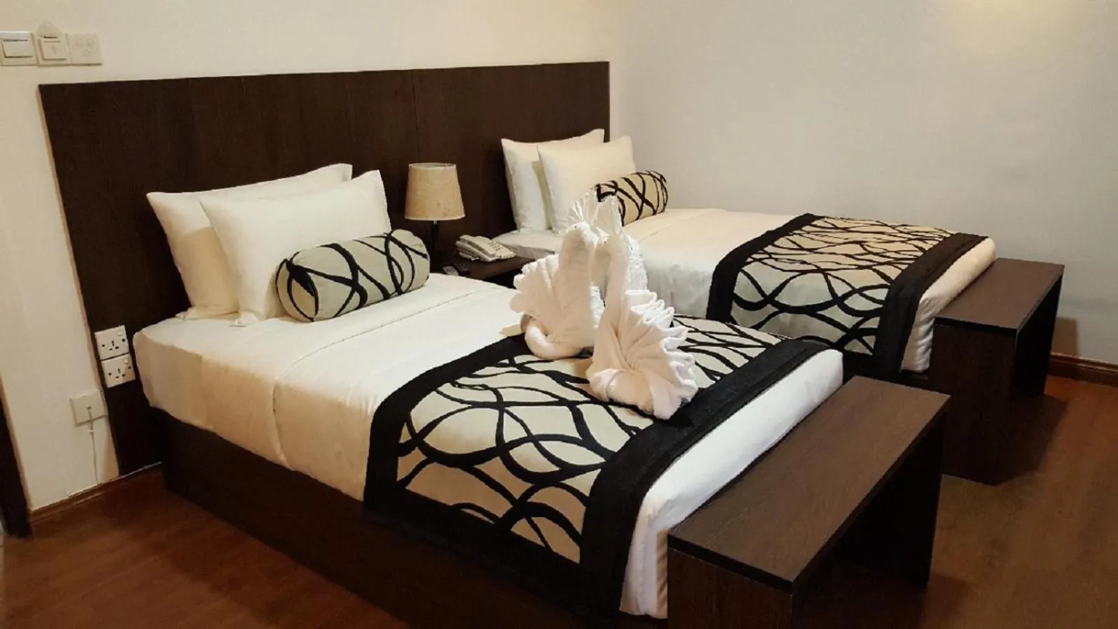 Bed in Nat City Hotel