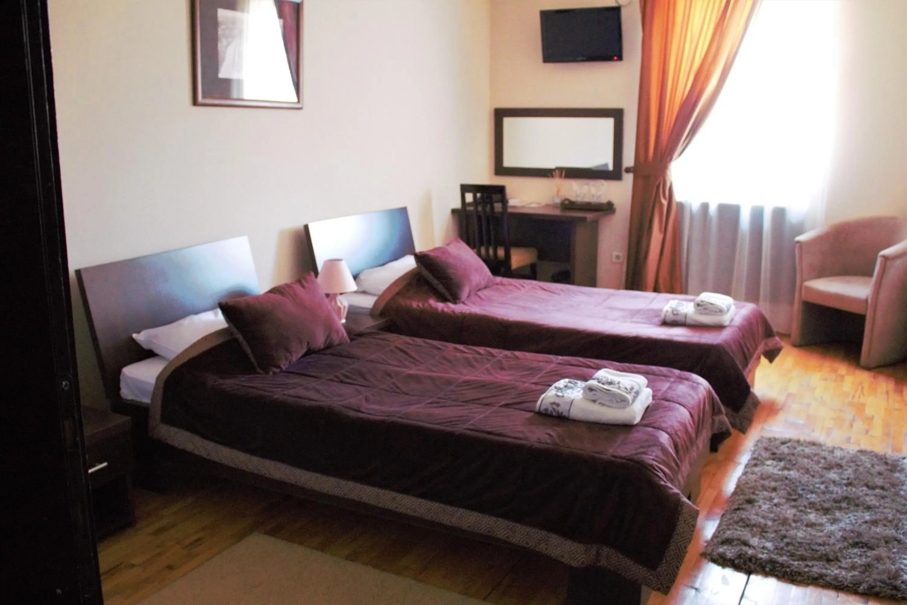 Bed in Garni Hotel City