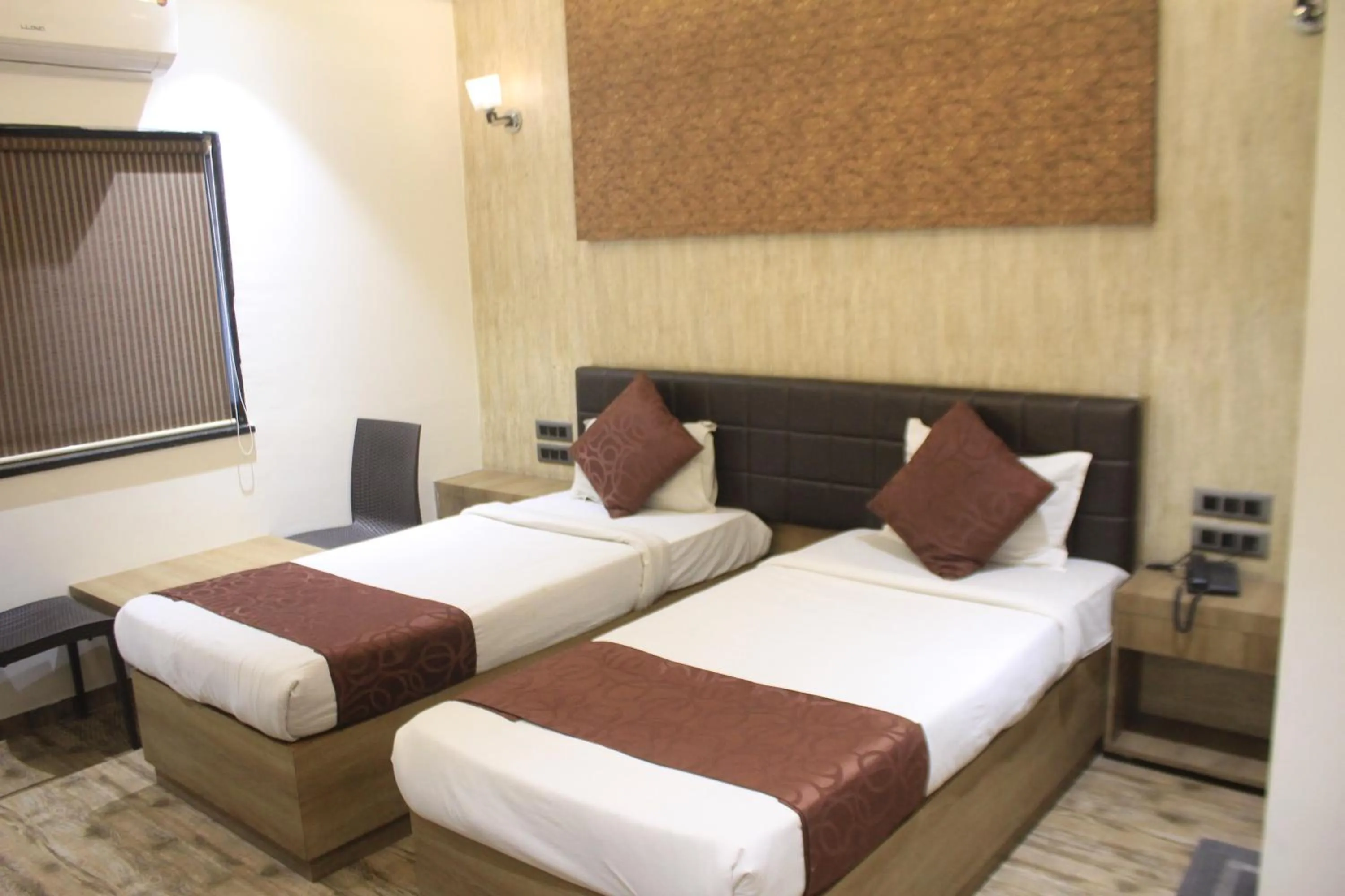 Bed in Hotel Sahyadri