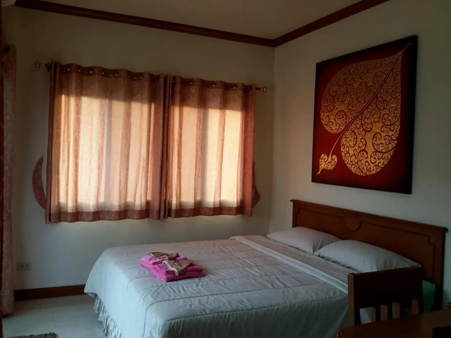 Bed in Donchai House Guest House& Cafe