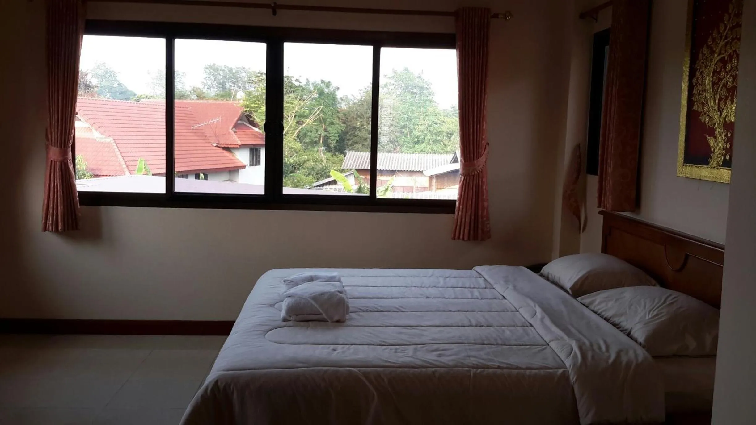 Bed in Donchai House Guest House& Cafe