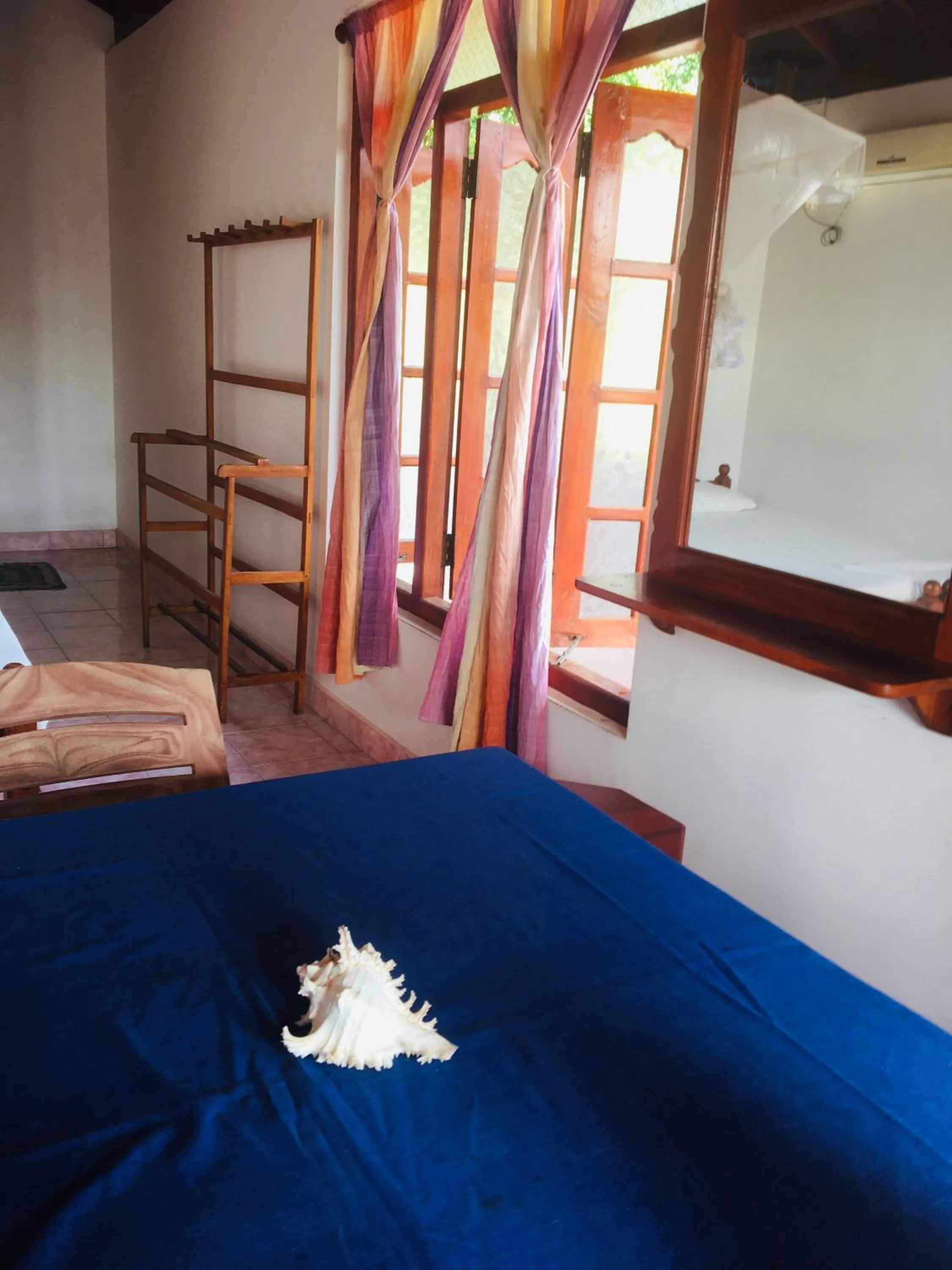 Bed in Dilena Beach Inn