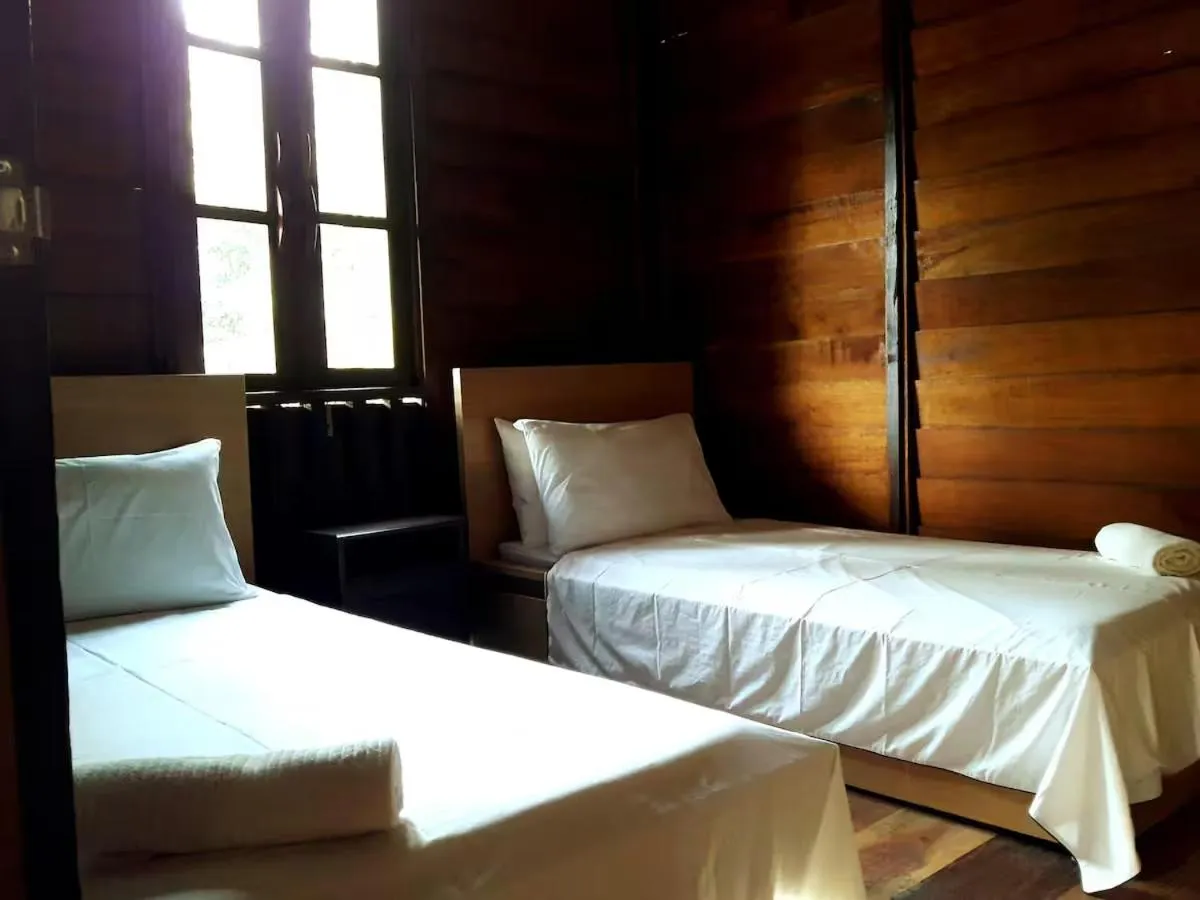 Bed in Bagas Zakariah Orchard Lodge