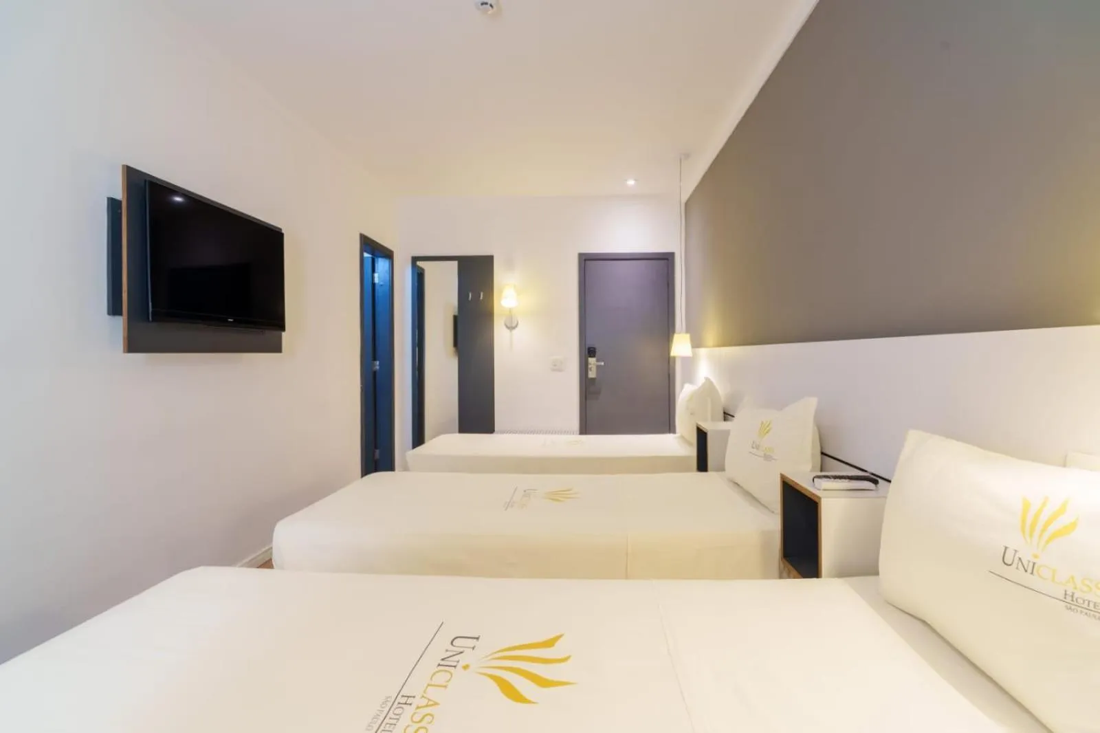 Bed in Uniclass Hotel Pinheiros