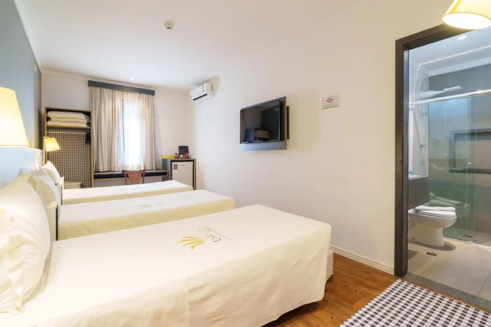 Bed in Uniclass Hotel Pinheiros