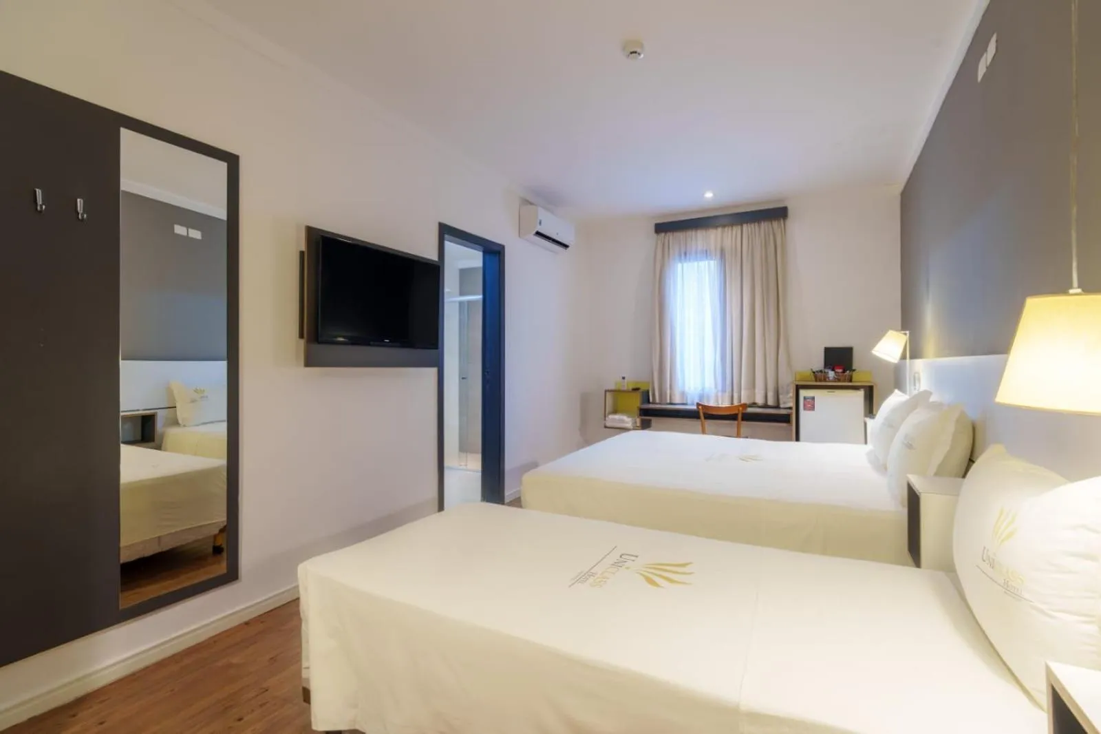 Bed in Uniclass Hotel Pinheiros