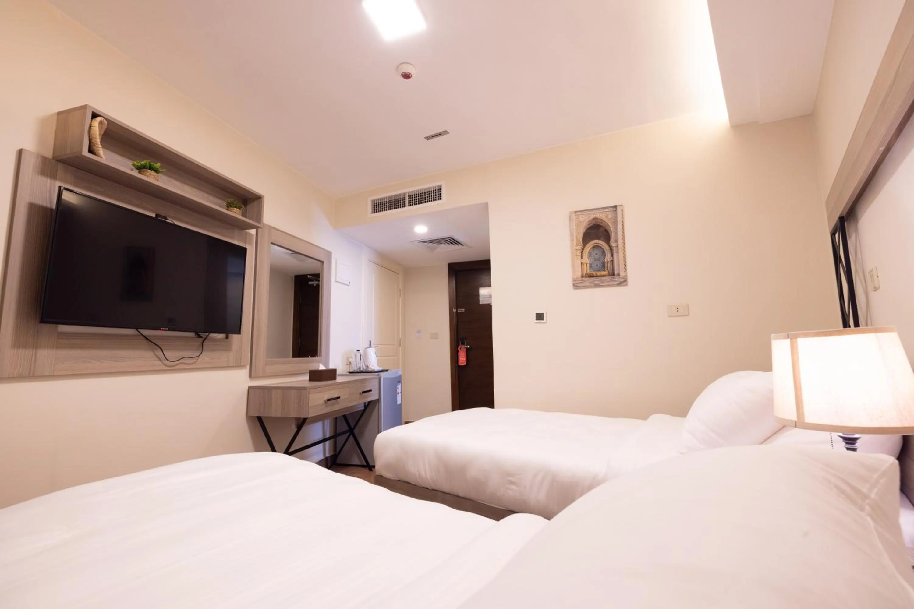 Bed in Sukoon Hotel Amman