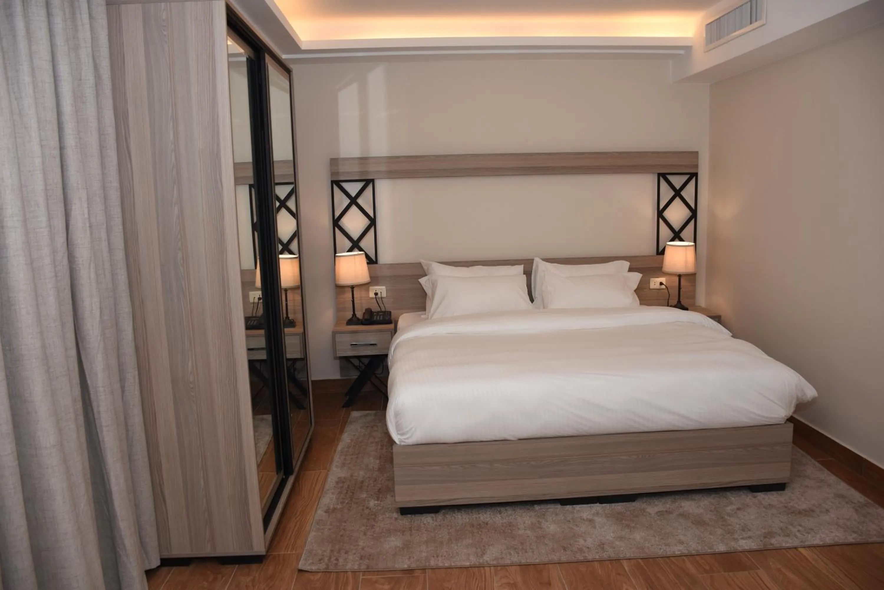 Bed in Sukoon Hotel Amman