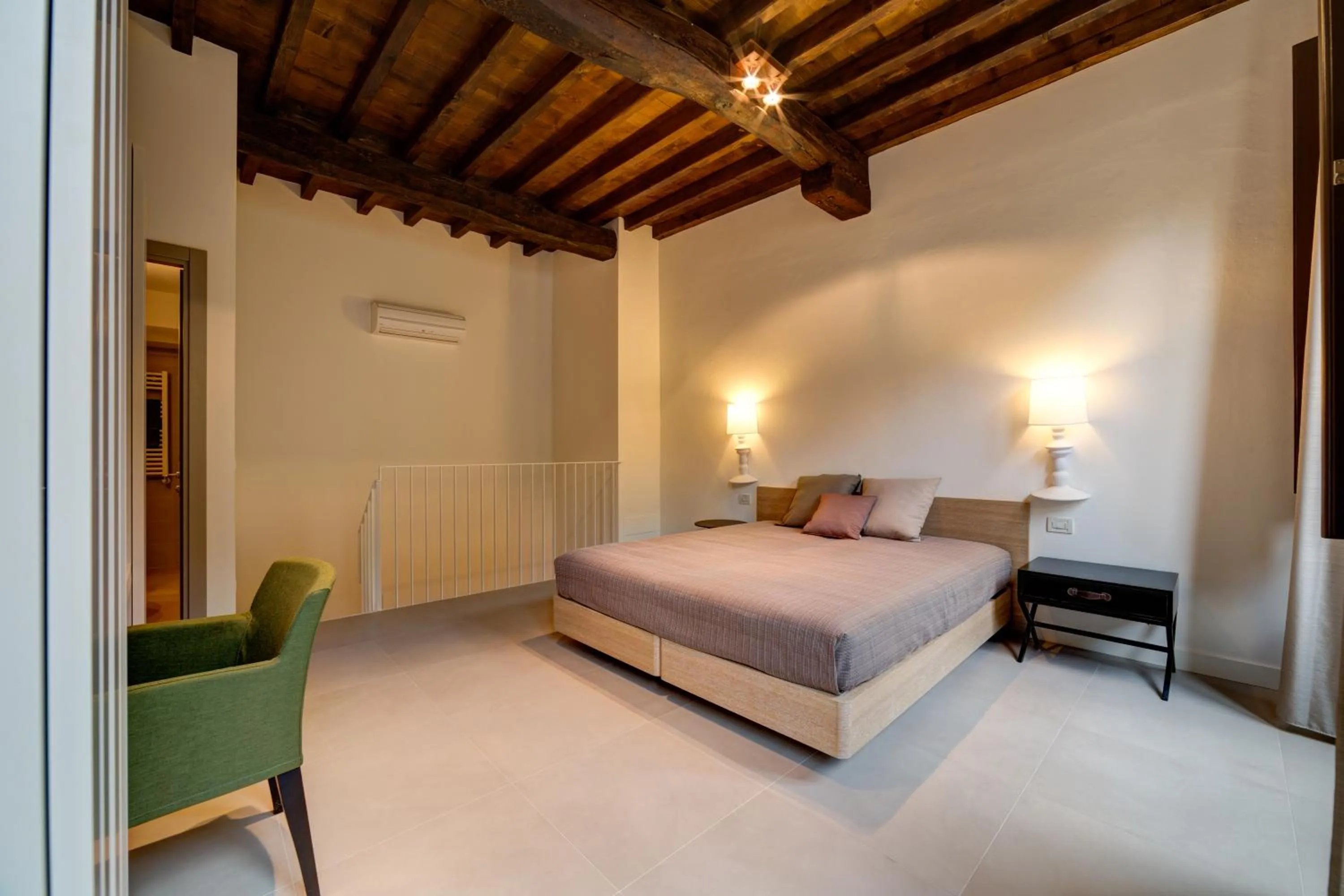 Bed in Palazzo Mannaioni Suites