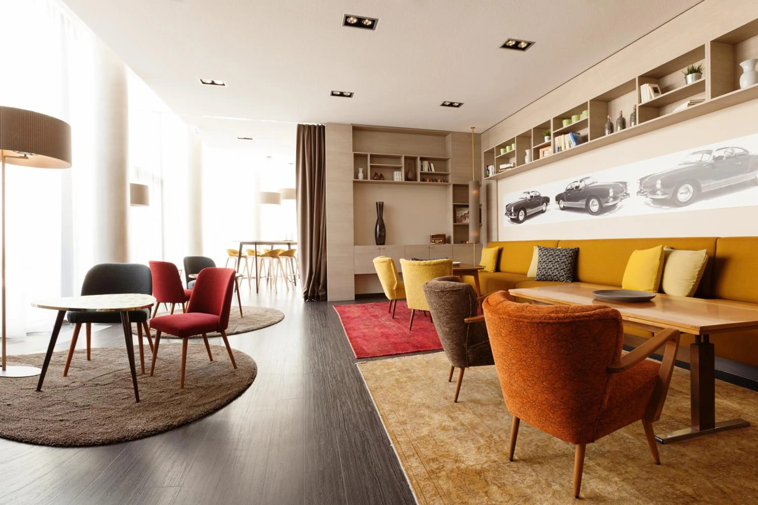 Communal lounge/ TV room in Vienna House Easy by Wyndham Osnabrück City & Apartments