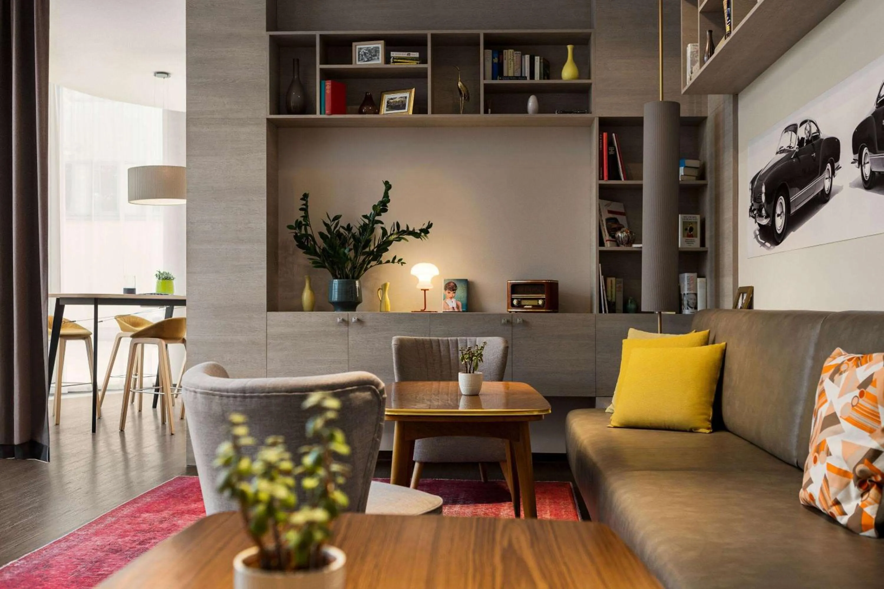 Communal lounge/ TV room in Vienna House Easy by Wyndham Osnabrück City & Apartments